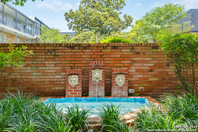 Beautifully remodeled 1st Floor condo! 2 Bedrooms, private patio, in-unit stackable washer/dryer!  New kitchen range and dishwasher. Lovely private courtyard with mature trees and a pool in a great location close to stores, restaurants, Alamo Heights, San Antonio Airport and major highways.   Assigned and covered parking area.  Make your showing appointment today!