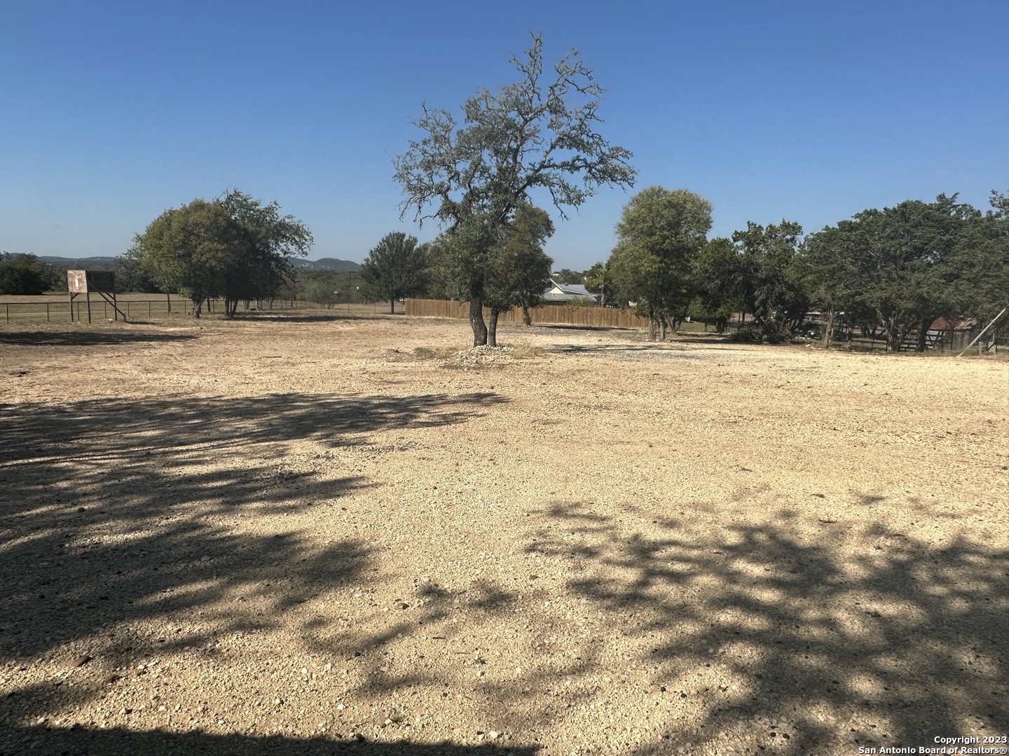 Large empty parcel, approximately 1 acre in size. Great visibility and access fronting Hwy 16 less than 1 mile out of the city limits.  Property is fenced, two storage buildings and a barn. Water , septic and electricity are available on site.  Rent $1,200, security deposit $2,000.