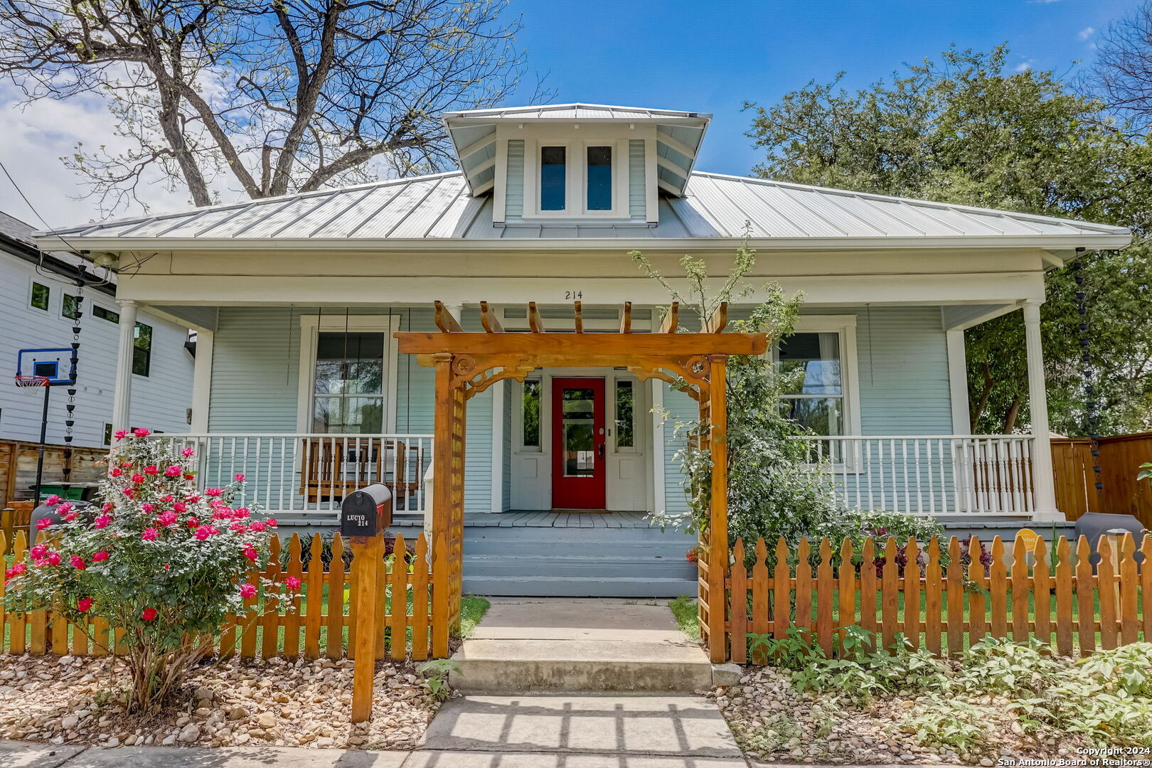 Relax with coffee and a book on the oversized front porch swing overlooking a charming rose garden. This beautiful single family home is conveniently located in the Southtown Arts District. Charming kitchen with natural light, original long - leaf pine hardwood floors. Tastefully updated not compromising the original character. Perfectly located a few blocks from Blue Star and the San Antonio River. Located a block away from trails connecting the San Pedro Creek. Easy access to the Mission Reach hike and bike trails, less than a mile to the nearest Grocery Store.  A 5 minute bike ride to HemisFair and the downtown business district.
