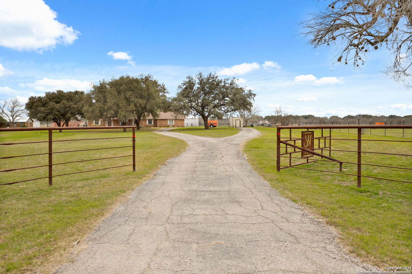 Renovated Beauty on 2 Acres - Move-In Ready and Loaded with Upgrades! This fully renovated 3-bed, 2.5-bath brick home sits on a gorgeous 2-acre lot with mature trees and quick access to town. Taken down to the studs and rebuilt in 2020, every inch of this home was designed with quality and style in mind. The chef's kitchen stuns with quartz countertops, a gas cooktop, double KitchenAid ovens, and custom cabinetry, all flowing into rich wood floors throughout the main living areas. Custom tilework, designer vanities, and unique finishes give the home a one-of-a-kind feel you won't find anywhere else. Energy efficiency is built-in with new Anderson windows and fully paid-for solar panels - real long-term savings! Enjoy a private well for irrigation, co-op water for the home, and a full sprinkler system to keep your landscape looking sharp. Spacious primary suite, oversized secondary bedrooms, and a layout that feels open yet cozy, truly turn-key and built to impress.