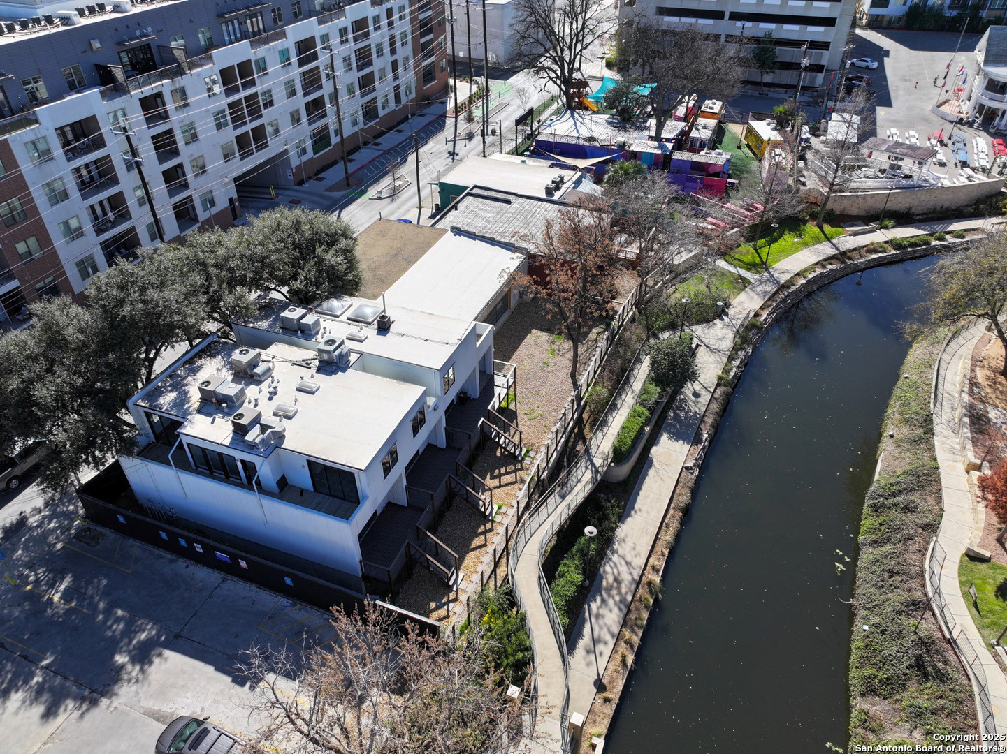 Rare Investment Opportunity on the Iconic San Antonio Riverwalk    An exceptional chance to own a piece of history in one of the most coveted and tranquil sections of the San Antonio Riverwalk. This unique property offers nearly 150 feet of prime river frontage and is nestled in a serene yet highly accessible location.    The offering includes three fully renovated, modern-contemporary townhomes-all currently leased-along with a spacious adjacent garage and an additional building, providing both current income and future development potential.  Whether you are seeking a distinctive downtown residence, envisioning a condo, apartment, or mixed-use development, or simply want to maintain it as a turnkey townhome investment, this property offers unmatched versatility.    Situated at the corner of Avenue B and East Jones Avenue, it is  just a short stroll to both the Pearl District and the heart of downtown Riverwalk. Enjoy a high walkability score, easy access to public transit, and bike-friendly surroundings. With close  proximity to San Antonio's most vibrant amenities-restaurants, museums, bars, and cultural attractions- yet quietly tucked away in a peaceful stretch of the Riverwalk.    Priced under $3 million, this one-of-a-kind opportunity will not last long. Schedule your private tour today and secure your place in the living history of downtown San Antonio.