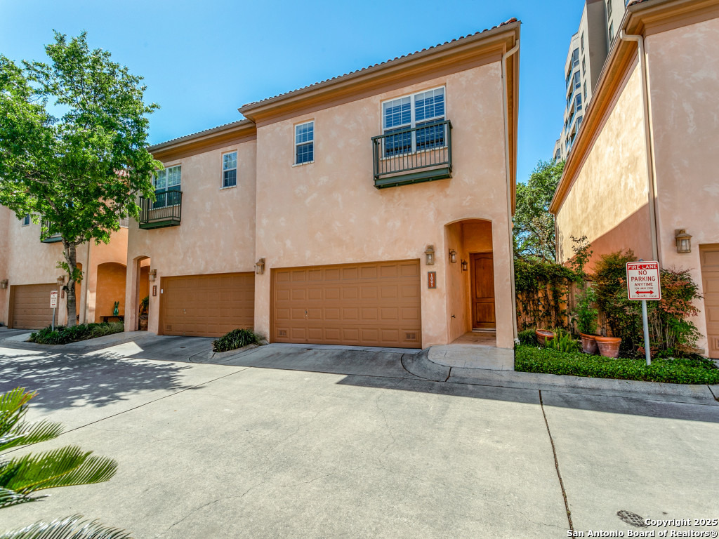 Beautiful, spacious townhome in Alamo Heights! This 3 bedroom, 2.5 bath beauty is in a gated community with lock-and-leave convenience. The high ceilings, open floor plan and spacious living areas promote gracious living. The gourmet kitchen with gas cooking and built in refrigerator, along with wet bar and wine refrigerator make entertaining a breeze. The primary suite is enormous and includes an office area. The HOA takes care of the roof, exterior of house, and front landscaping. Don't miss it!