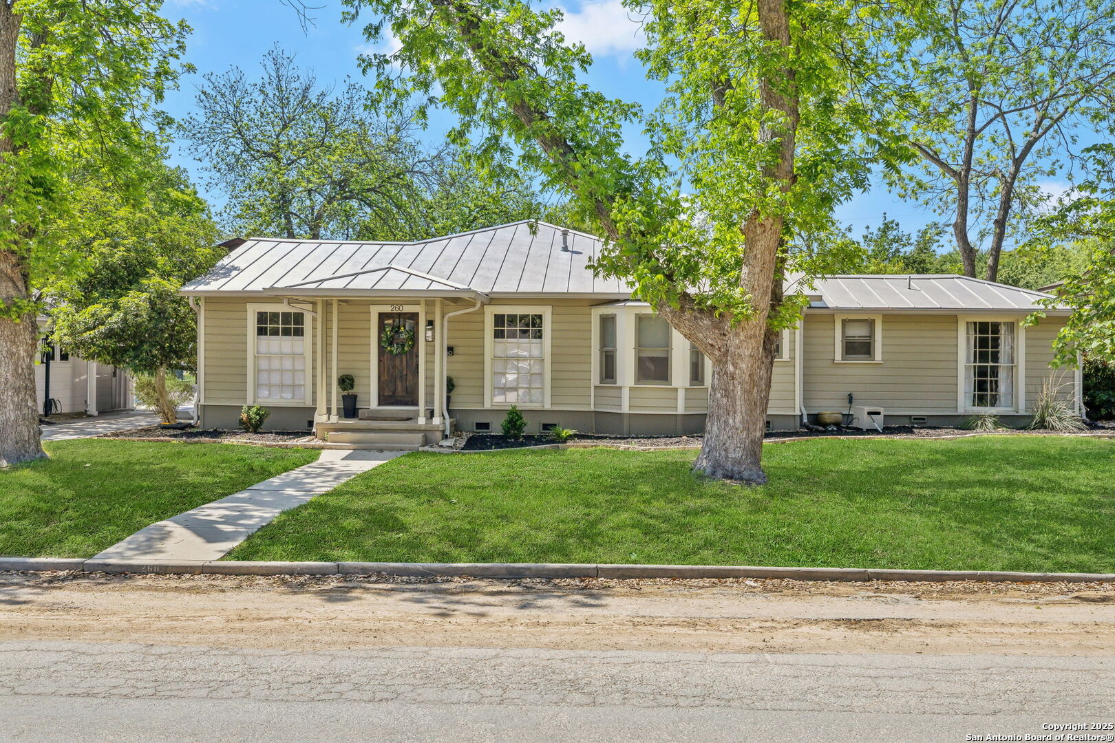 This charming Alamo Heights home offers a rare, true 4-bedroom, 4-bath layout, with each bedroom privately situated for ultimate comfort. The home was completely redone in 2021 to include foundation, electrical, plumbing, and all mechanical systems. A versatile flex space adjoins one of the bedrooms, perfect for a home office or game room. Enjoy two spacious living areas, a built-in bar with a wine fridge, and a kitchen that seamlessly opens to the main living space. The kitchen features timeless soapstone countertops, stainless steel appliances, and custom cabinetry. Great pantry & a buit-in desk off the kitchen. Dedicated laundry room with drop space! The expansive primary suite boasts two separate closets, providing ample storage. Step outside to a charming screened-in porch overlooking a beautiful Keith Zars pool & spa - your own private retreat. Additional highlights include an alley-access two-car garage and a prime location in sought-after Alamo Heights.