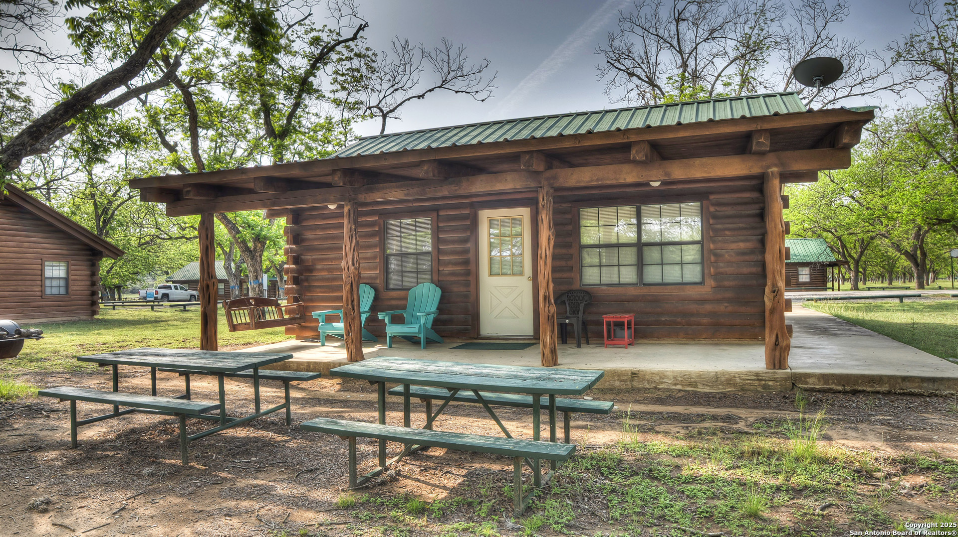 Here is a great opportunity to become an owner in the popular "Frio Pecan Farm"!  This offering features a beautiful view of the Frio River right from the covered porch. An open kitchen/living combo greets you as you enter and the two bedrooms share a connected bath. All furnishings and appliances convey with sale....totally turn-key!  Buy now and receive rental income this summer. In addition, owners enjoy all of the amenities of this highly sought after vacation destination:  7000 sq. ft. pavilion,  professional BBQ cookhouse, Frio River access, children's playscapes, firepits scattered about the property, and a top-notch rental management operation.
