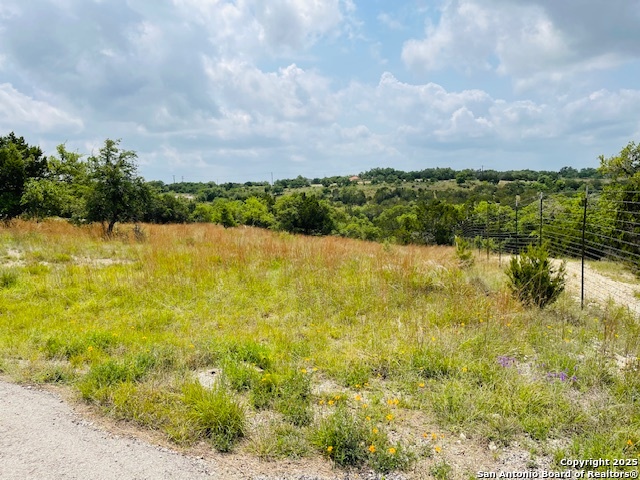 Welcome to an exceptional opportunity to build in a sought-after cul-de-sac location! This 1-acre lot offers the rare flexibility of residential or commercial use. Enjoy the convenience of a nearby elementary school and the vibrant community amenities including a pool, park with basketball and volleyball courts, and boat/RV storage. A beautifully crafted 1,800 sq ft minimum home is required. Seller also offers a full set of custom-designed 4-plex plans, available separately or negotiable with the sale. Whether you envision a dream home or an income-producing property, this lot delivers endless possibilities in a prime setting.