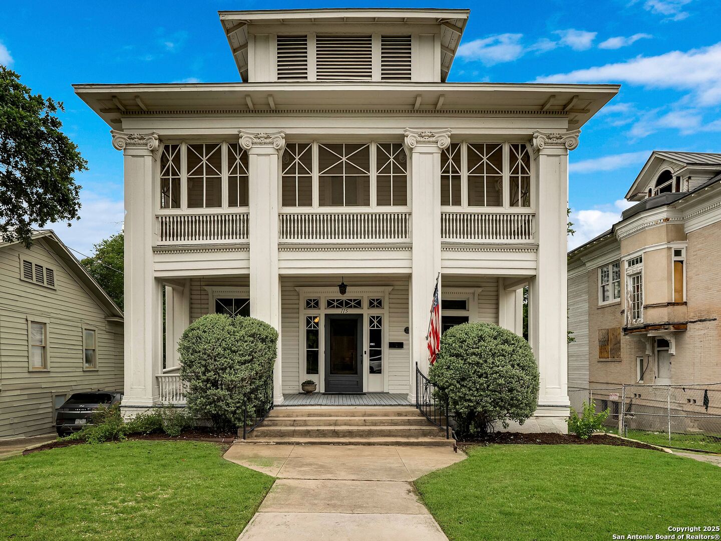 Open House Saturday May 10th 1pm-3pm. Historic Greek Revival home in Monte Vista, originally built in 1890 by A.G. Dugger and moved to its current location from East Mulberry in 1910. Known as the Sam Napel home, this two-story residence offers 4 bedrooms, 2 baths, and a rare basement, blending timeless architecture with everyday comfort. A grand covered front porch with stately columns and a screened upper porch add to the home's classic appeal. Inside, the formal living room features beamed 10-foot ceilings, hardwood floors, an imposing fireplace, and custom-built-in shelving. Transom and sidelight windows fill the home with natural light. The formal dining room includes pocket doors, chair railing, and picture molding. The kitchen boasts a sink beneath large windows, glass-front cabinets, gas cooking, a walk-in pantry, a butler's pantry, and a roomy breakfast room. A built-in storage bench beneath the staircase offers a welcoming spot to pause before heading upstairs. The primary bedroom is on the main floor with an adjoining bath featuring a tub/shower combo. Upstairs, a spacious landing with a curved railing provides the perfect nook for reading, art, or study. Three additional bedrooms and one full bath complete the second floor, including an 18x15 bedroom with excellent potential to convert into a second primary suite. Located just minutes from the Pearl, Zoo, museums, downtown, and within walking distance to restaurants, shops, and several private schools, this home is a rare opportunity to customize in historic Monte Vista.