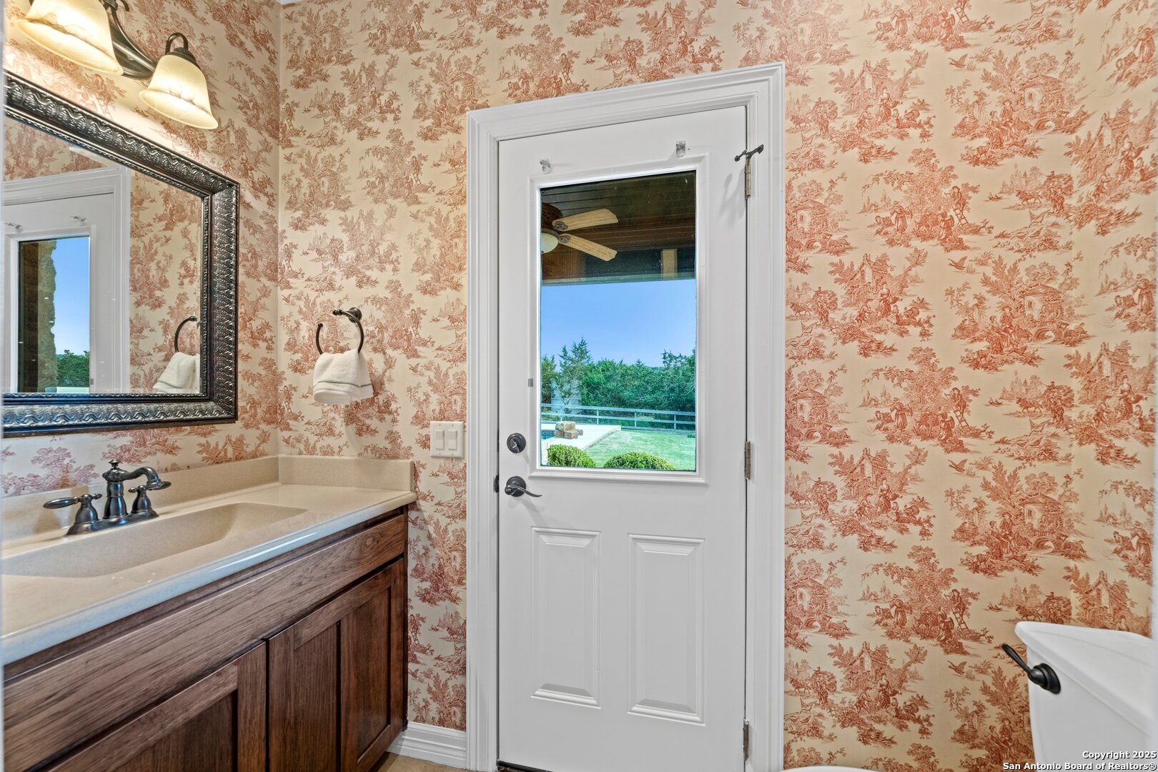 Half bath off the kitchen access to the pool