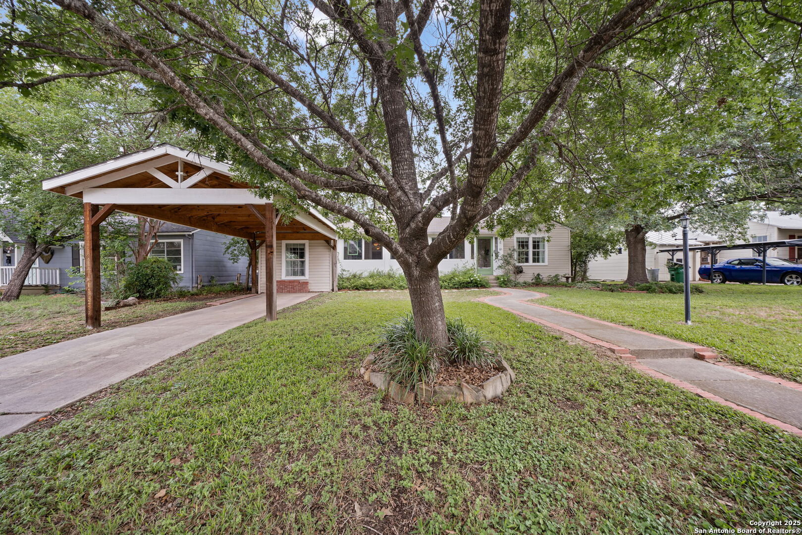 ***ASSUMABLE VA LOAN 2.78 % with $319,619 balance to qualified VA buyers*** Nestled in the highly desirable Terrell Hills neighborhood, this stunning single-story home offers 4 bedrooms and 3 bathrooms on a generous 1/3-acre lot. An enclosed front porch welcomes you into the home, providing a charming entrance. The large entry foyer opens into the living room, which features beautiful wood flooring and a cozy fireplace, creating a warm and inviting atmosphere. The open dining room is perfectly positioned next to the kitchen, with easy access to the back patio for seamless indoor-outdoor living. The kitchen is a chef's dream, with abundant cabinetry, granite countertops, stainless steel appliances, an island for extra prep space and storage, and a breakfast bar for casual dining. The kitchen's many windows offer views into the expansive backyard, allowing natural light to fill the space. The private primary bedroom suite provides a peaceful retreat with a double vanity, tub/shower combo, and a spacious walk-in closet. Nicely sized secondary bedrooms offer comfort and flexibility, with guest bathrooms conveniently located nearby. Step outside to the oversized covered deck, built in hot tub / spa ideal for entertaining or relaxing, which leads to a level backyard with lush greenery. A garden shed offers additional storage space for tools and gardening supplies. This home is ideally located with easy access to Hwy 281 and I-410, just minutes from the airport, the San Antonio Zoo, local shopping, and exceptional dining options.