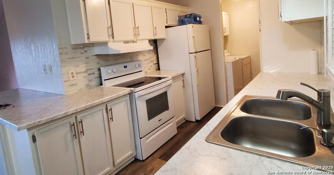 Kitchen stove, refrigerator and cabinets