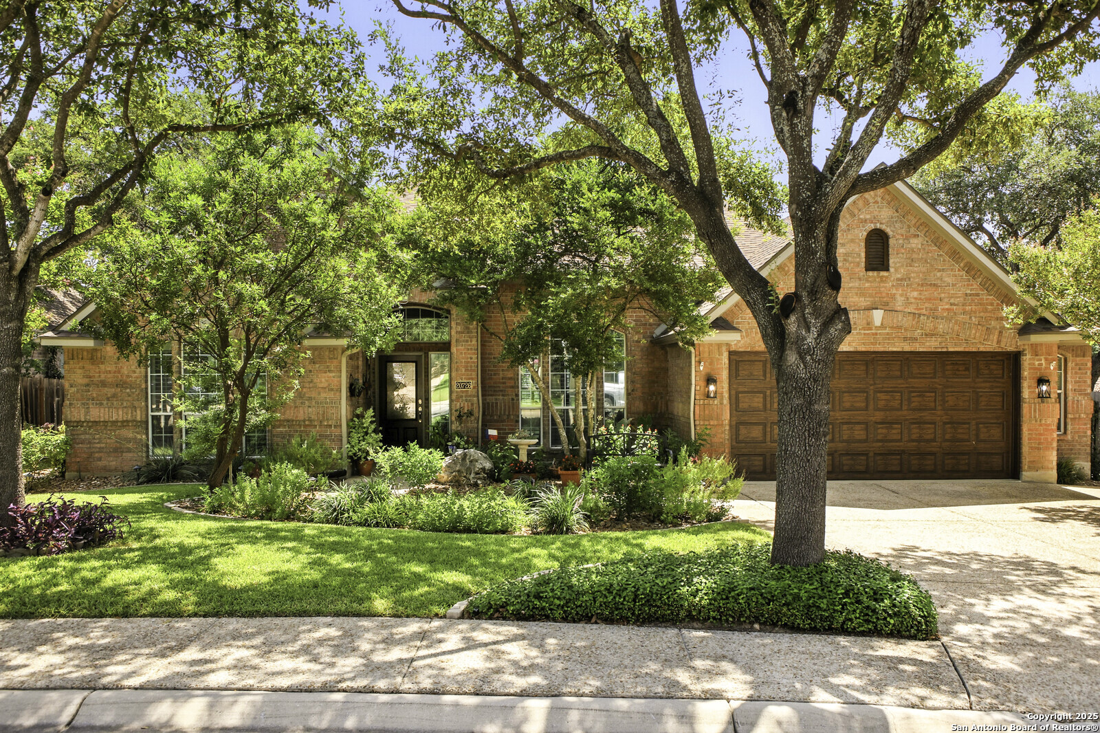MULTIPLE OFFERS HAVE BEEN RECEIVED. Please submit your final and best offer by July 24 at 9:00 AM. Welcome Home to Stone Oak Living! Discover this beautifully maintained single-story home nestled in the heart of Stone Oak! This residence boasts exceptional curb appeal and inviting outdoor spaces. Inside, you'll love the spacious open floor plan offering 4 bedrooms, 2.5 baths, and an oversized garage-perfect for comfortable living. Gorgeous wood floors run throughout, making upkeep a breeze. The gourmet kitchen features solid surface countertops, stainless steel appliances, and double ovens, making it ideal for both home chefs and entertainers alike. Step outside to your perfectly manicured outdoor oasis, complete with a Mosquito Nix system and remote-controlled fogger, so you can enjoy the outdoors comfortably all year round. Enjoy neighborhood amenities, including a clubhouse, pool, playground, sports courts, and even a pickleball court! Plus, you're within walking distance of restaurants, HEB, and top-tier retail options. The neighborhood is served by highly rated NEISD schools. This home truly has it all. Schedule your tour today and make this dream home yours!