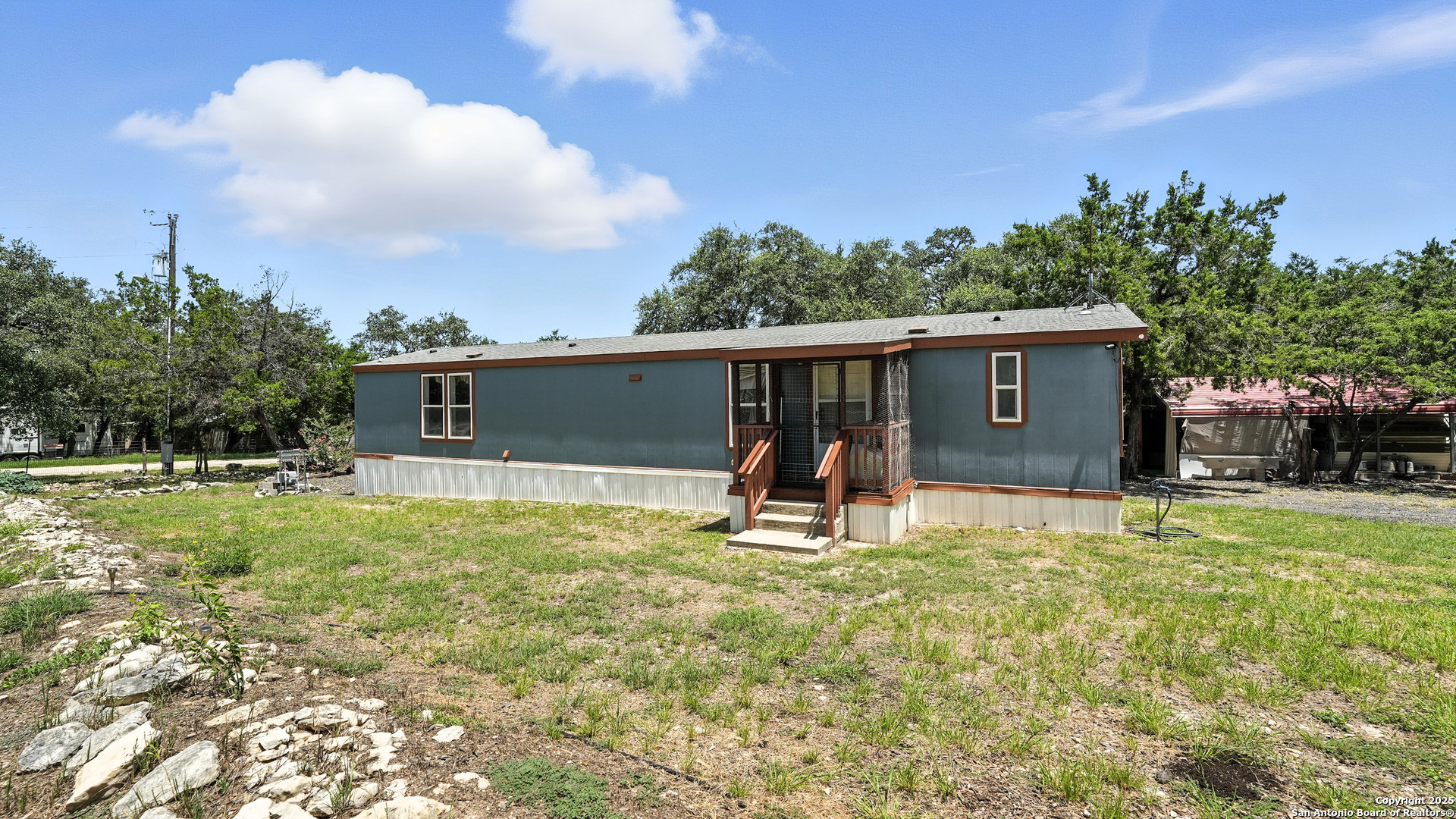BACK OF THE MOBILE HOME