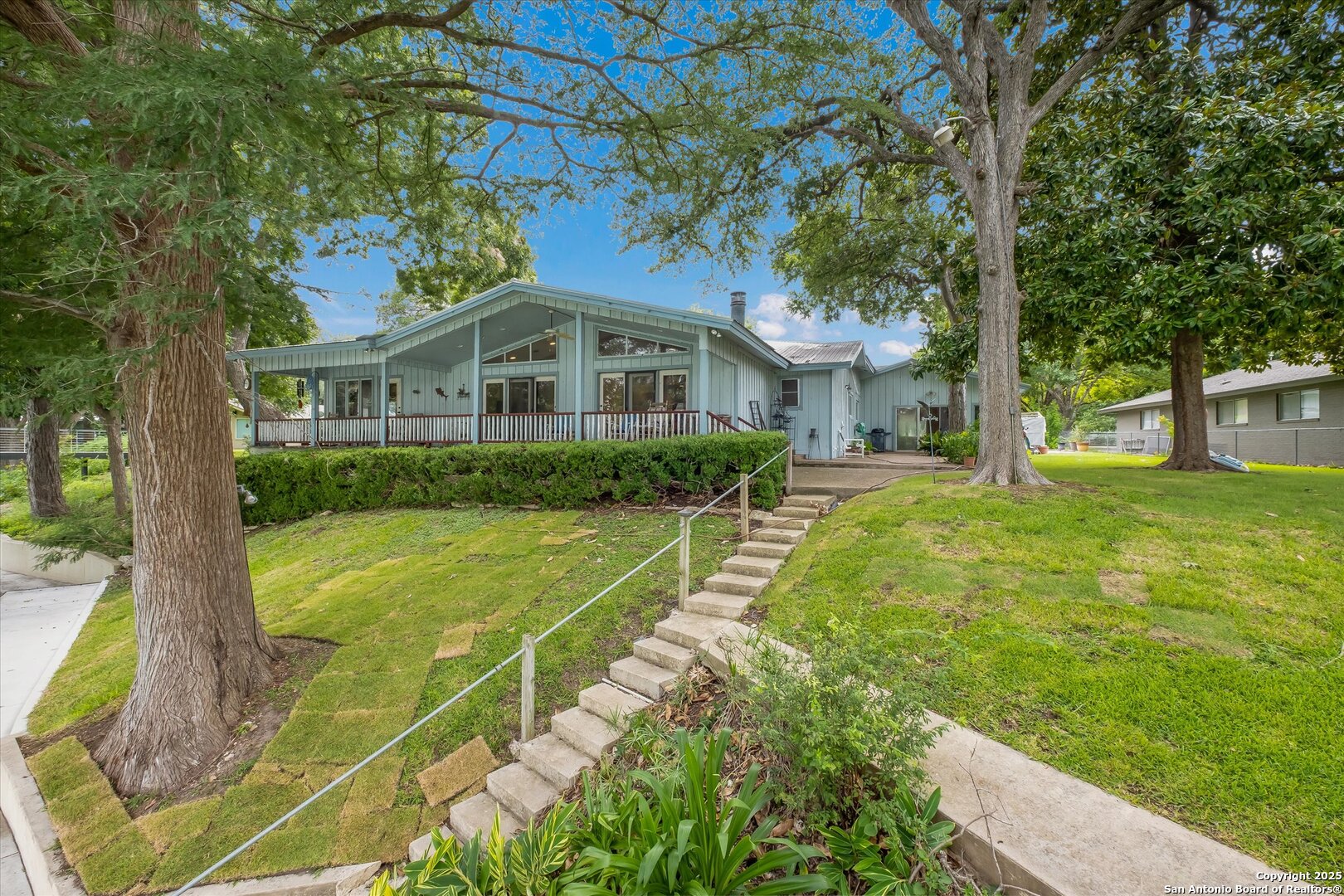 View looking at back of house from the river