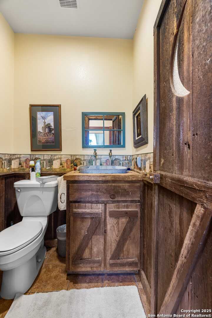 First 1/2 Bath off Utility/Sauna Room