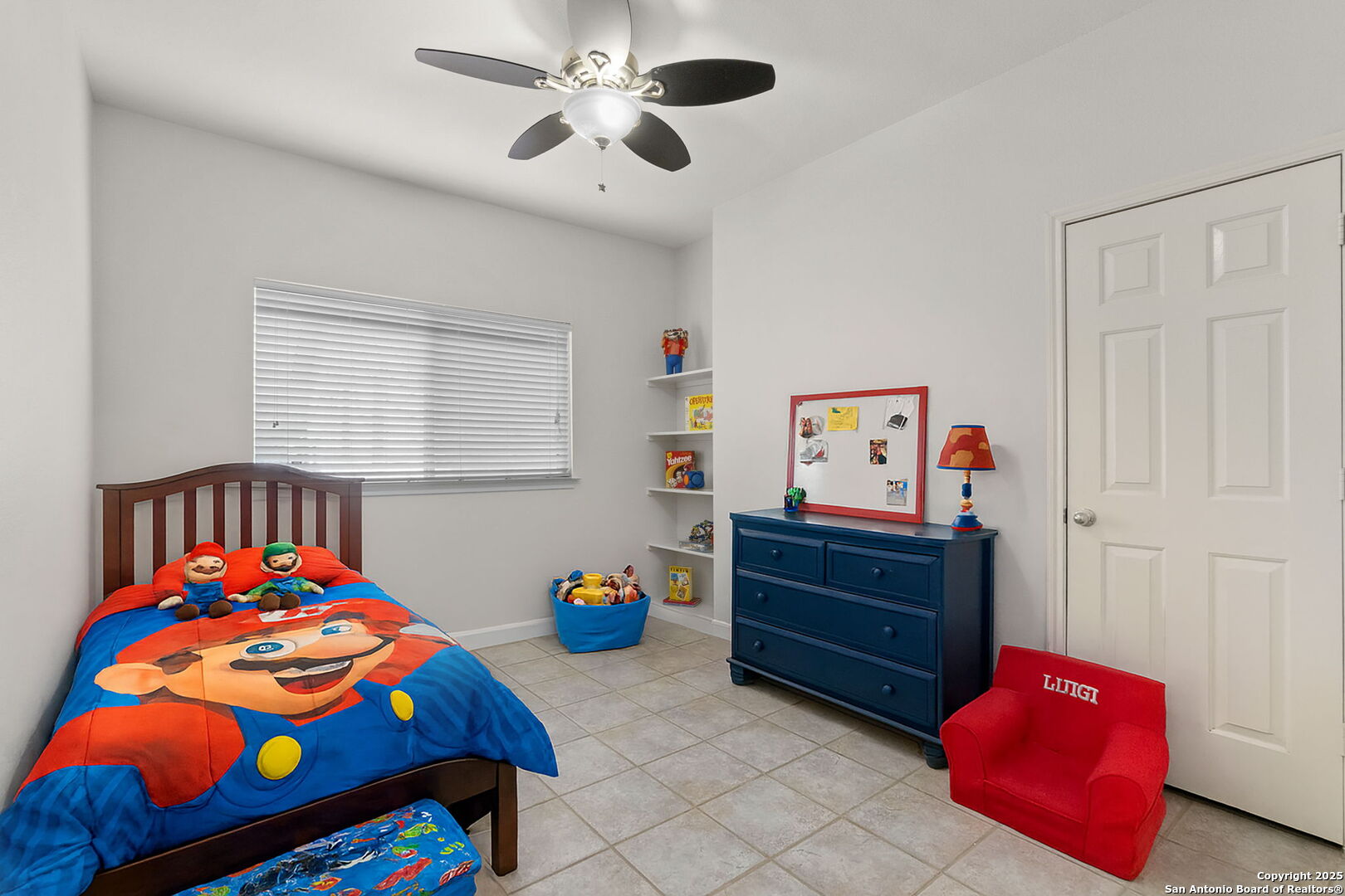 Bedroom 2 with built-in shelves