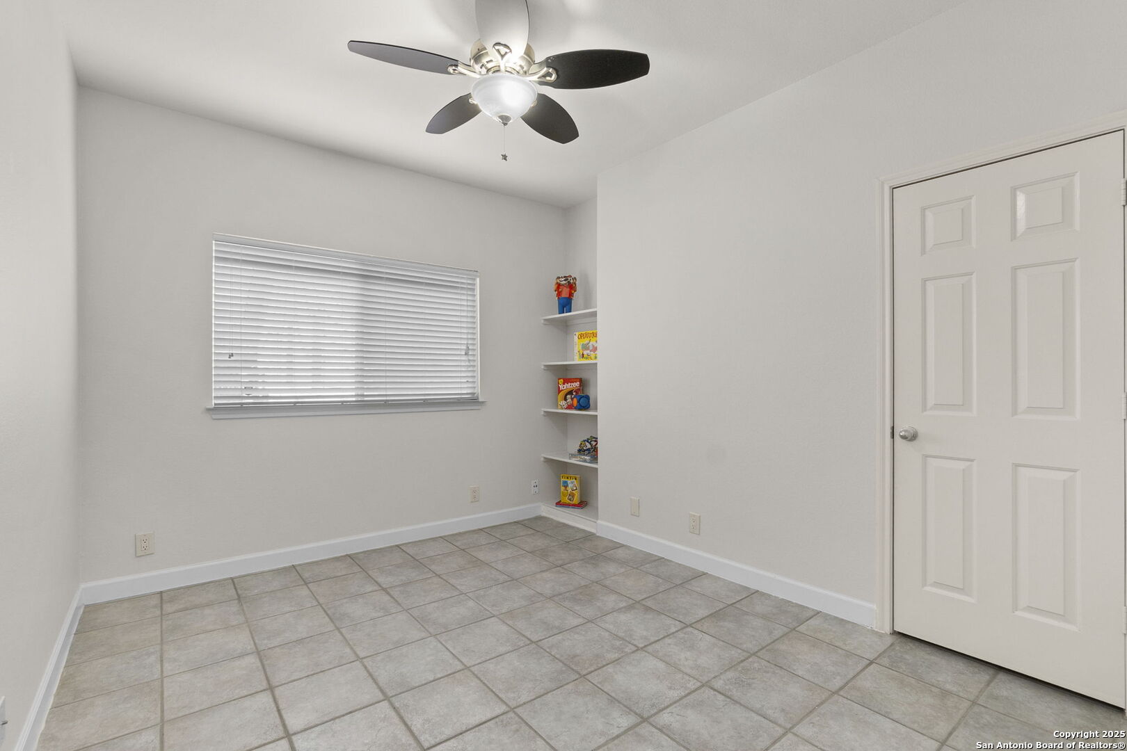 Bedroom 2 with built-in shelves