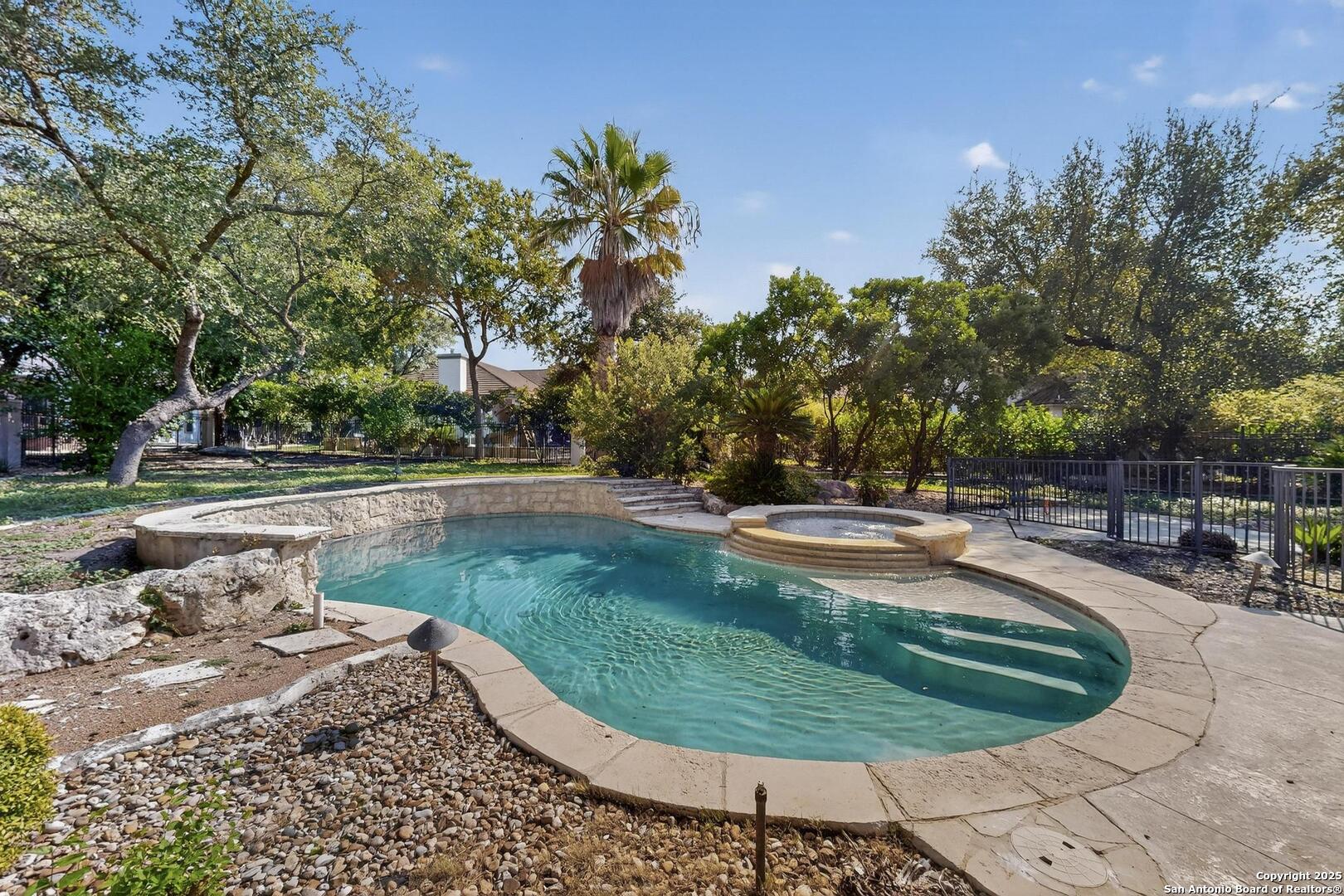 SIDEVIEW OF POOL AND HOT TUB