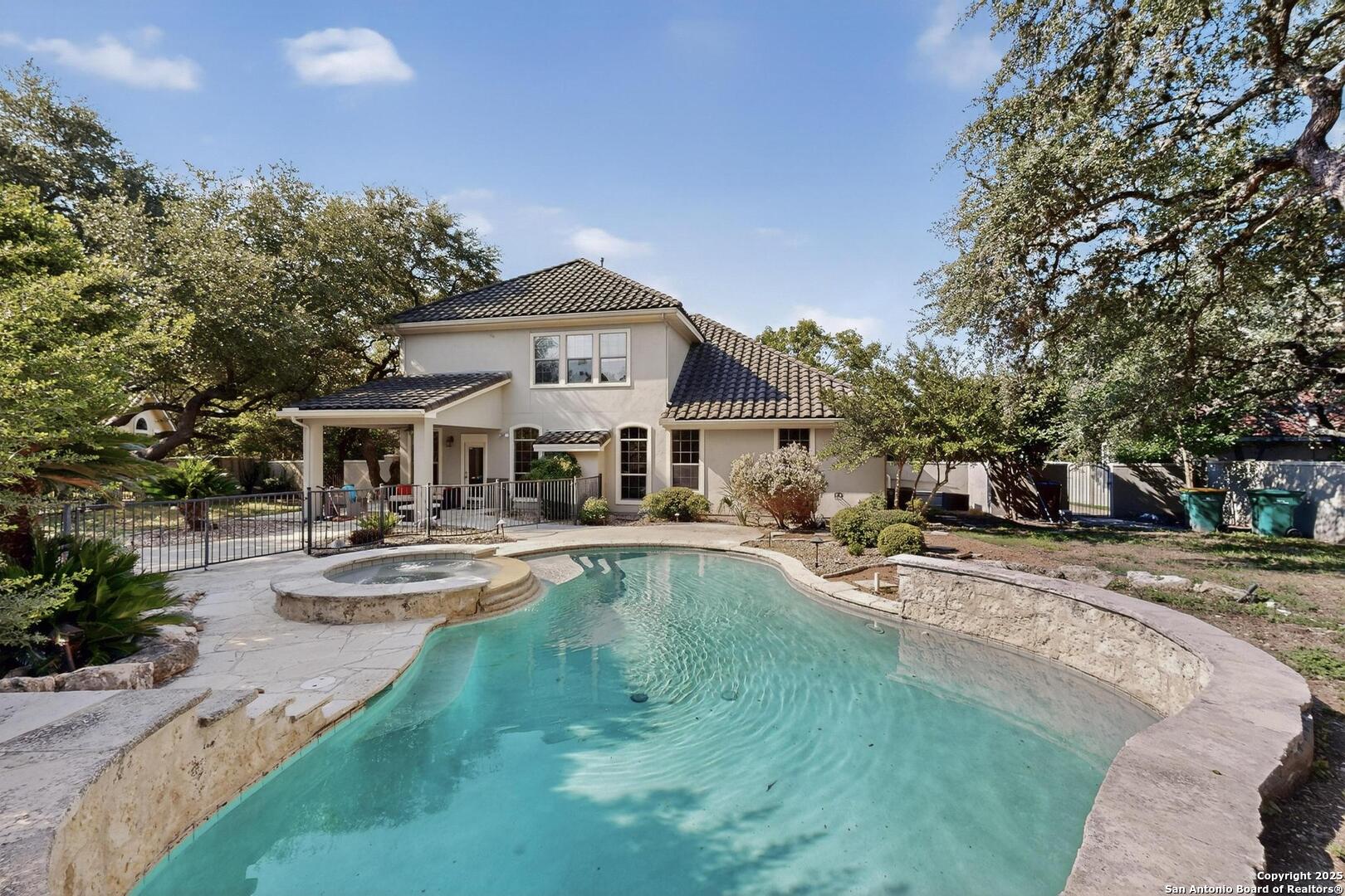 BACK OF HOUSE AND VIEW OF POOL