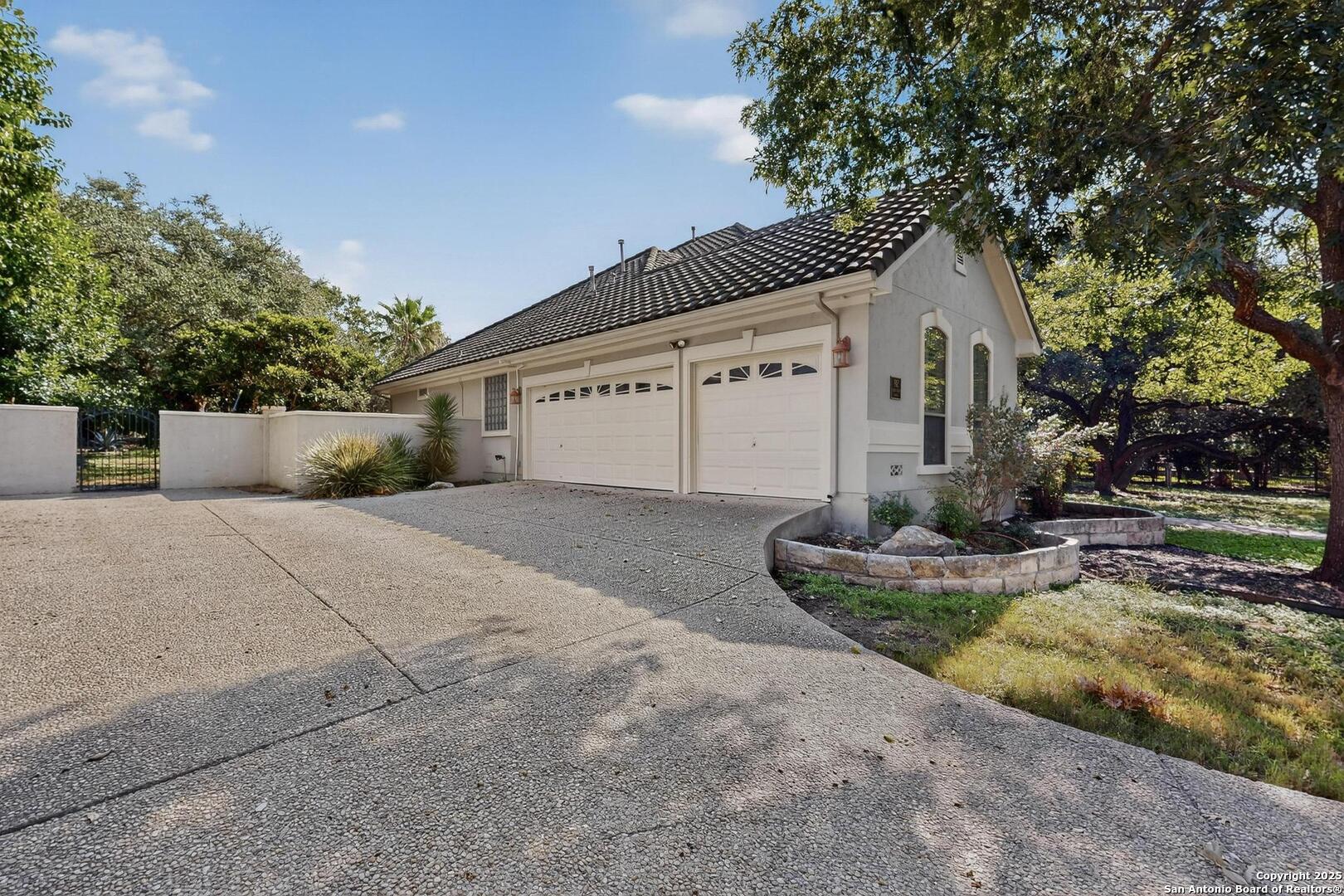 THREE CAR GARAGE AND PAD FOR CARS