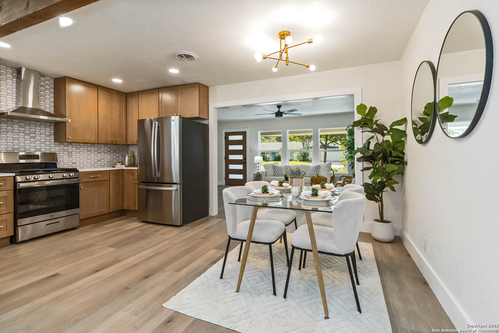 Welcome Home to Alamo Heights Living  This beautifully renovated 1956 bungalow offers the perfect blend of charm, comfort, and modern convenience-all within the highly rated Alamo Heights School District. Ideally located just .3 miles from the elementary school and .5 miles from the middle school, daily routines and after-school activities are just a short walk or bike ride away.  Step inside and you'll find a warm and flexible layout designed with easy living in mind. A front, formal living room welcomes you in and can easily be transformed into a spacious dining room for holidays, dinner parties, or game nights. The family room and eat-in kitchen provide the heart of the home, where modern finishes, open sight lines, and everyday functionality come together. Laundry has also been thoughtfully moved inside from the garage for added convenience.  Outdoors, the home shines with its spacious backyard, perfect for kids, pets, or weekend gatherings. The original hand-painted tile patio adds a touch of timeless character, offering a unique space for morning coffee or summer barbeques. The detached garage is a true perk, easily adaptable into a game room, gym, workshop, or hobby space-whatever fits your family's lifestyle.  With thoughtful updates throughout and a location that's second to none, this charming bungalow makes it easy to enjoy the best of Alamo Heights living. Gain instant equity in this home now!