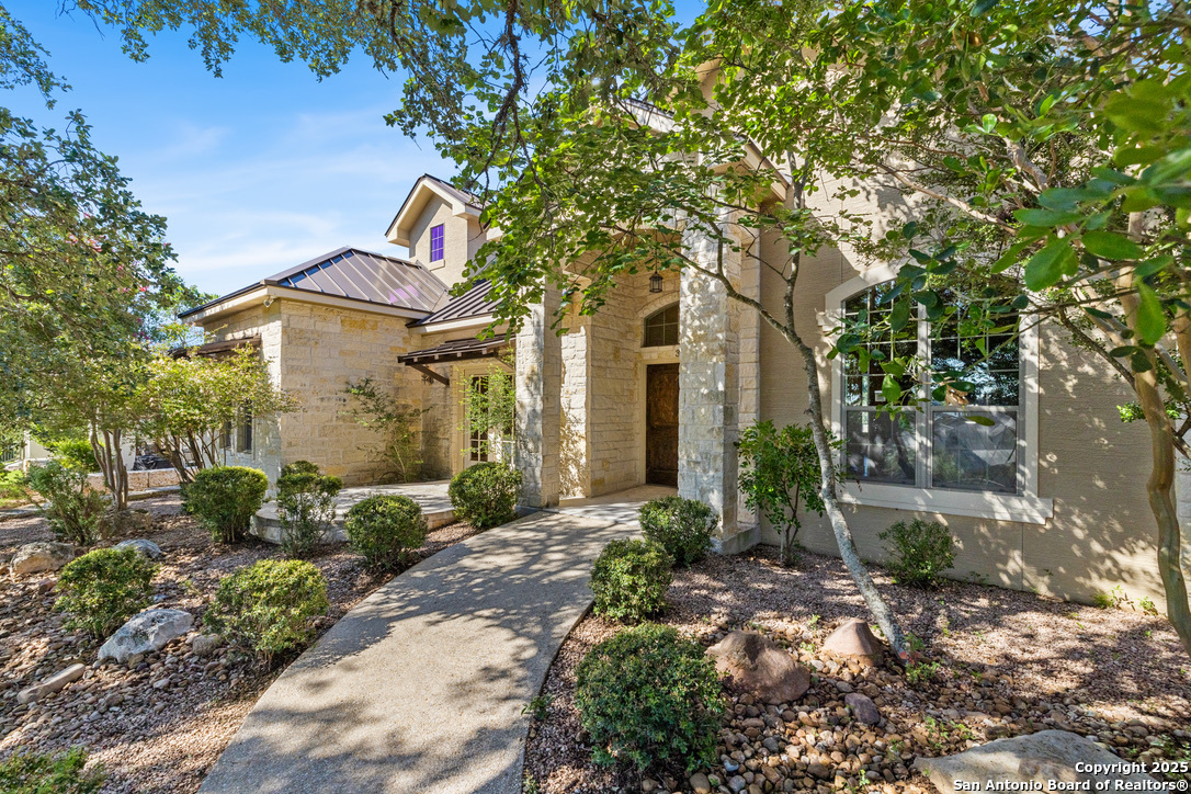 Tree Covered Entry with xeriscape landscaping