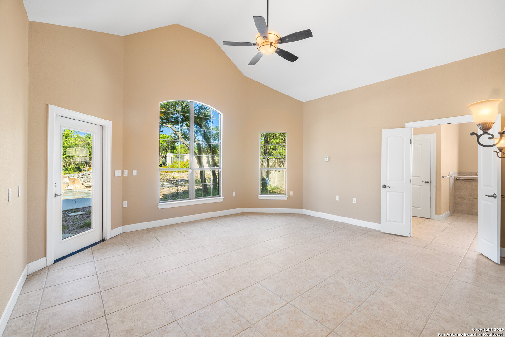 Generous Primary bedroom opens to pool area