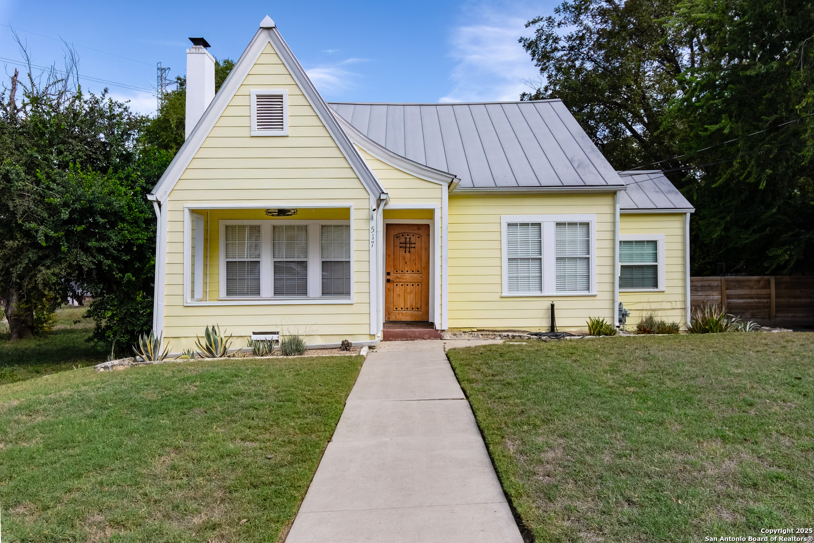 OPEN HOUSE SATURDAY11/29/2025 11am to 2pm. Welcome to 517 W Hollywood, a gem nestled in the heart of Alta Vista, San Antonio, where the charm of 1928 architecture meets modern-day convenience. This beautifully maintained 3-bedroom, 2-bathroom home is perfect for families looking to plant roots in a vibrant community.    Step inside and be captivated by the stunning hardwood flooring that flows throughout the house, creating a warm and inviting atmosphere. The recent AC upgrade in 2022 ensures your comfort in the Texas heat, while the cedar closet adds a touch of elegance and practicality to your storage needs.    The exterior boasts a durable metal roof, ensuring longevity and peace of mind. Entertaining is a breeze with the Flagstone patio and sidewalk leading to an astroturf backyard where kids can play and adults can relax with minimal upkeep. The backyard also features a convenient storage and workshop area, perfect for hobbies or additional storage space.    517 W Hollywood is more than just a house; it's a place where memories are waiting to be made. Experience the blend of tradition and comfort in this welcoming home, and envision your family's future in the heart of San Antonio. Your story begins here!