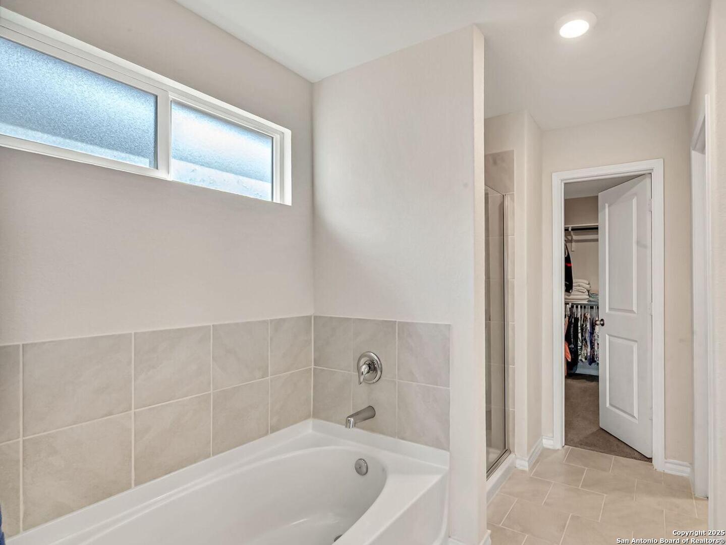 Featuring a soaking tub and separate shower