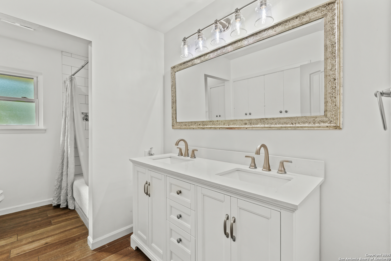 Dual vanities with framed mirror