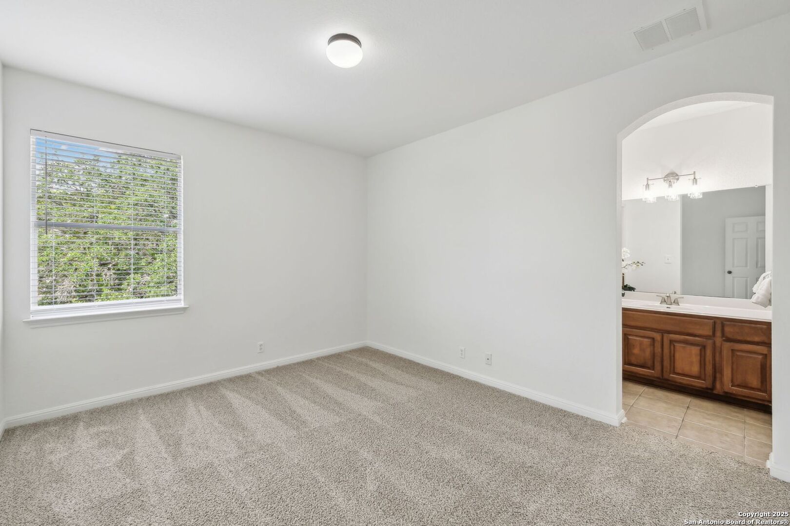 Bedroom with ensuite bathroom and walk in closet
