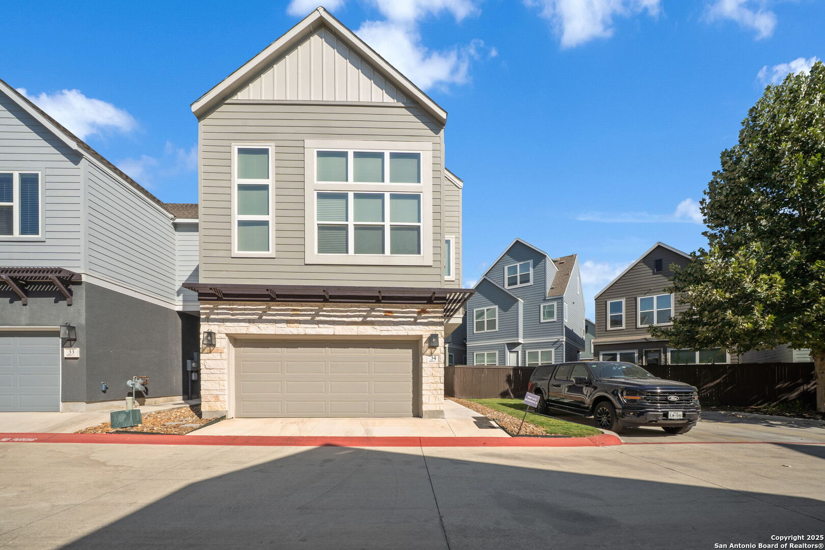 2-car garage, adjacent guest parking spaces