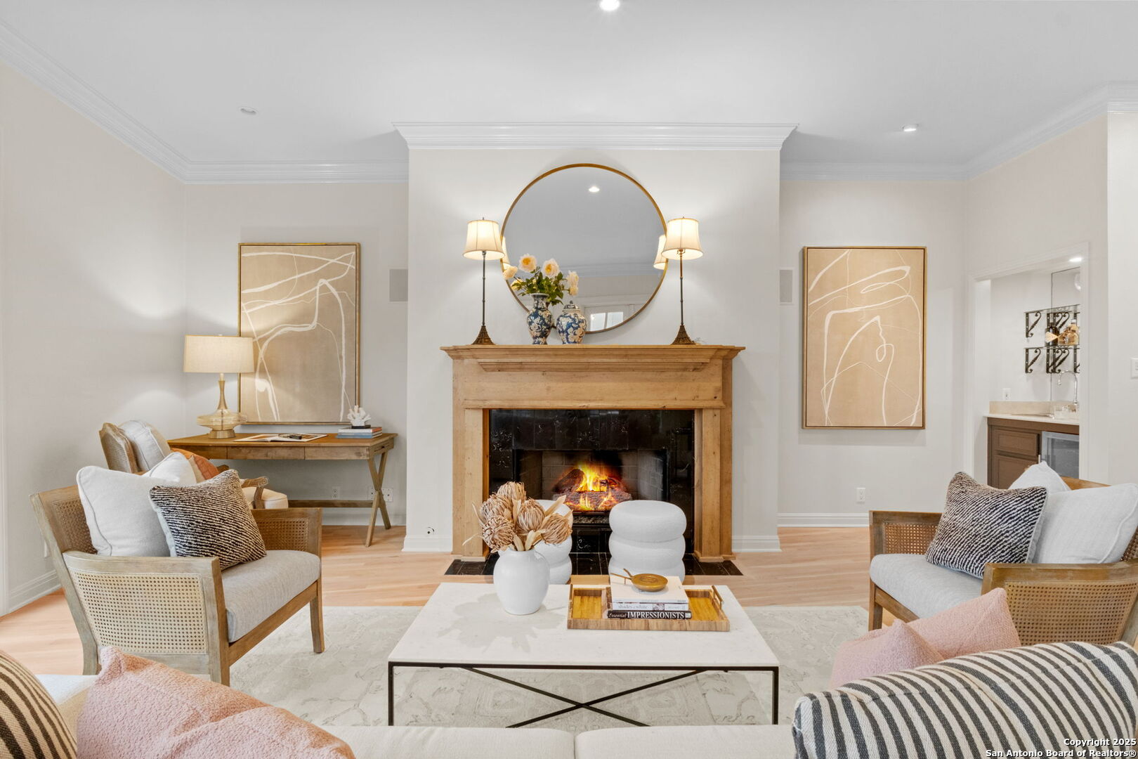 Discover an exceptional lock-and-leave lifestyle in The Heights at 110 Kennedy-an exclusive enclave of just eight luxurious townhome-style condominiums, ideally situated in the heart of Alamo Heights. Recently renovated and thoughtfully designed, this residence blends contemporary sophistication with timeless comfort. Expansive floor-to-ceiling windows bathe the open living spaces in natural light, while handsome light oak wood floors and high ceilings create a bright, welcoming ambiance. Designed for modern living with a timeless appeal, the interior is perfect for entertaining and everyday living. The chef's kitchen features high-end appliances, stylish stainless counters, and abundant storage. The living room, complete with fireplace, bar sink, and wine refrigerator, opens through French doors to a private walled patio with a soothing water feature and stone pavers for effortless outdoor enjoyment. With dual primary suites-one on each level-both offering fully renovated spa-like baths and generous walk-in closets, flexibility and comfort abound. An oversized two-car attached garage provides convenience and additional storage. Located within walking distance to Alamo Heights' vibrant shopping, dining, and within close proximity to the cultural corridor leading to The Pearl, this home offers the perfect blend of luxury, location, and ease.