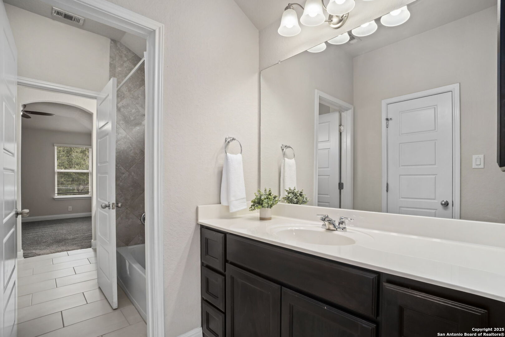 Connecting bath, private vanities bedrooms 2 & 3