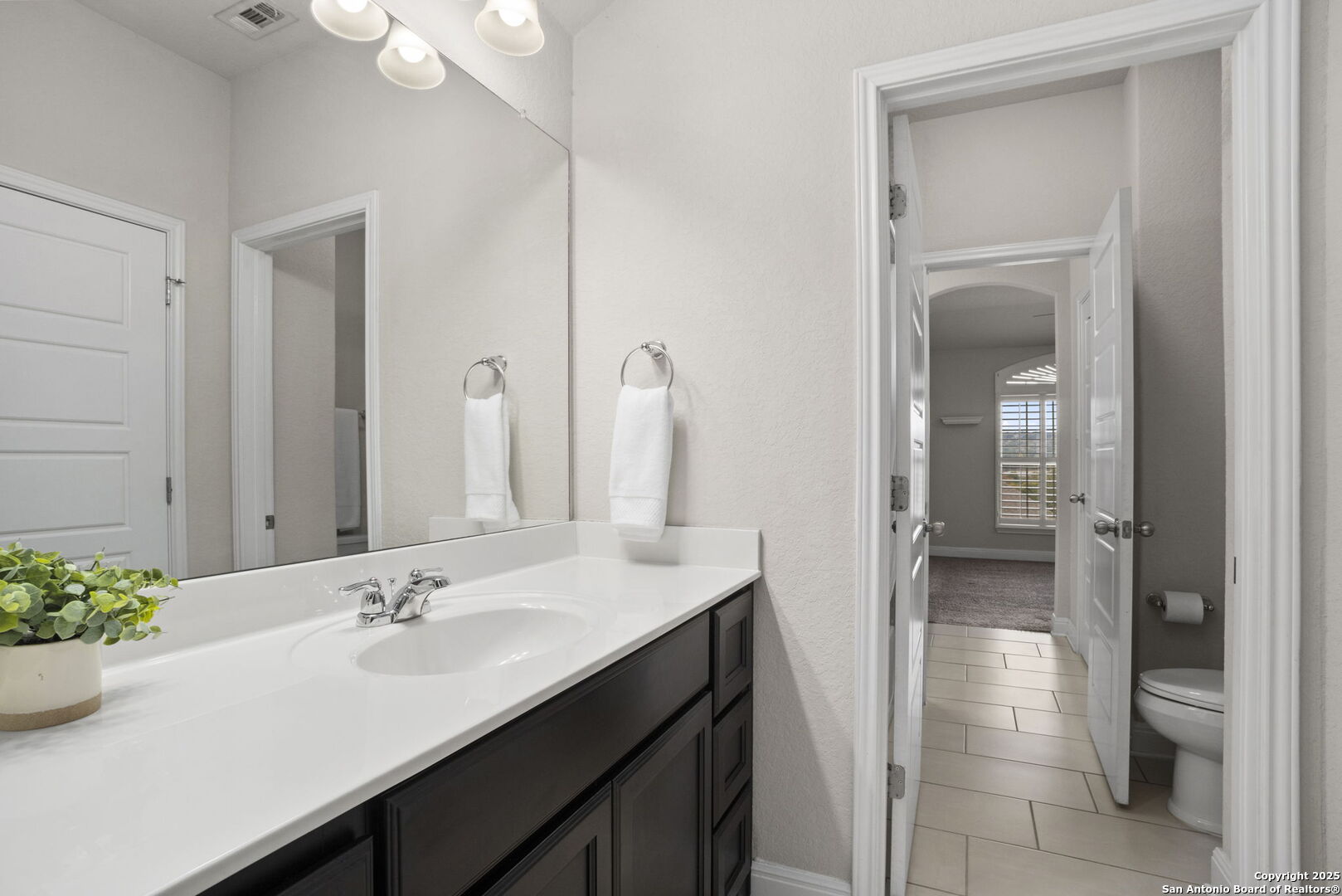 Connecting bath, private vanities bedrooms 2 & 3