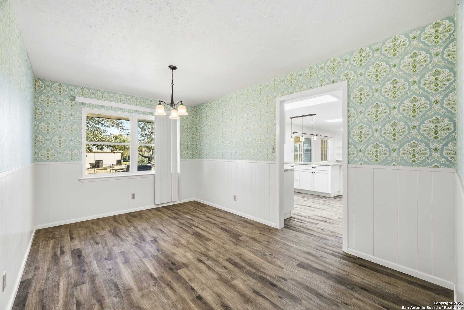 Large formal dining area off of kitchen.