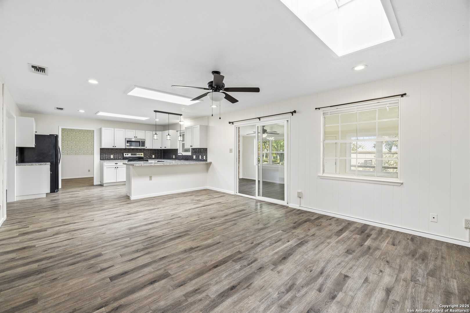 View from family room to kitchen-open-3 skylights