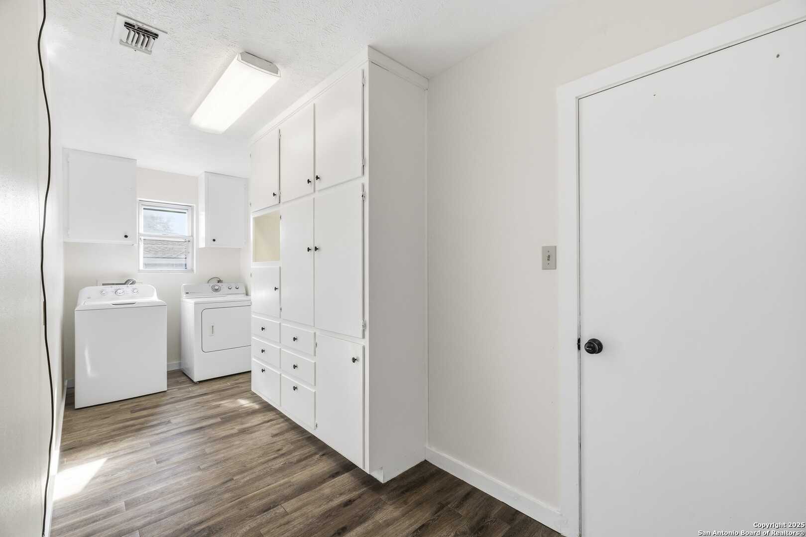 Large room w lots of cabinet storage.