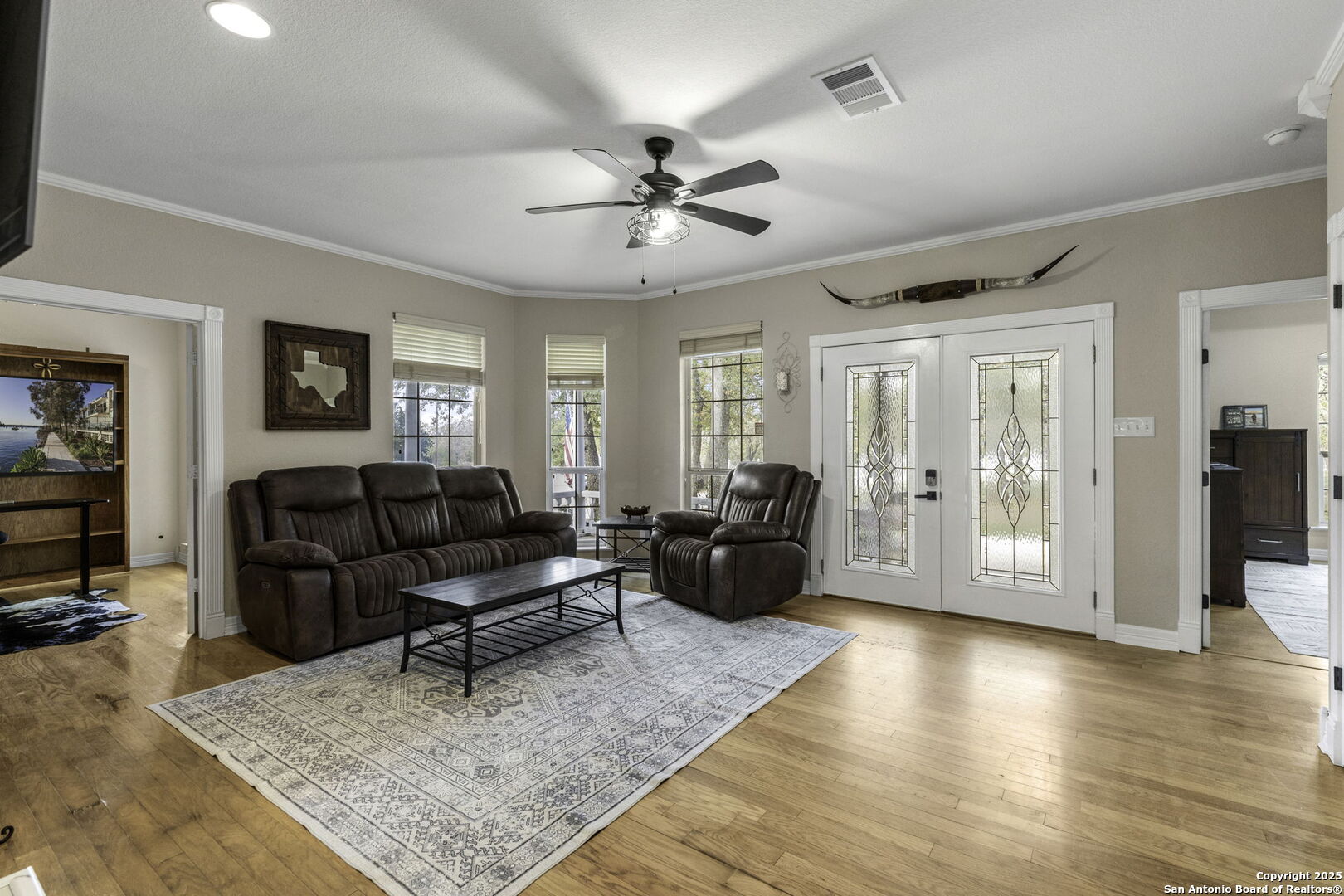 Main home living room.  Wood flooring, fireplace.