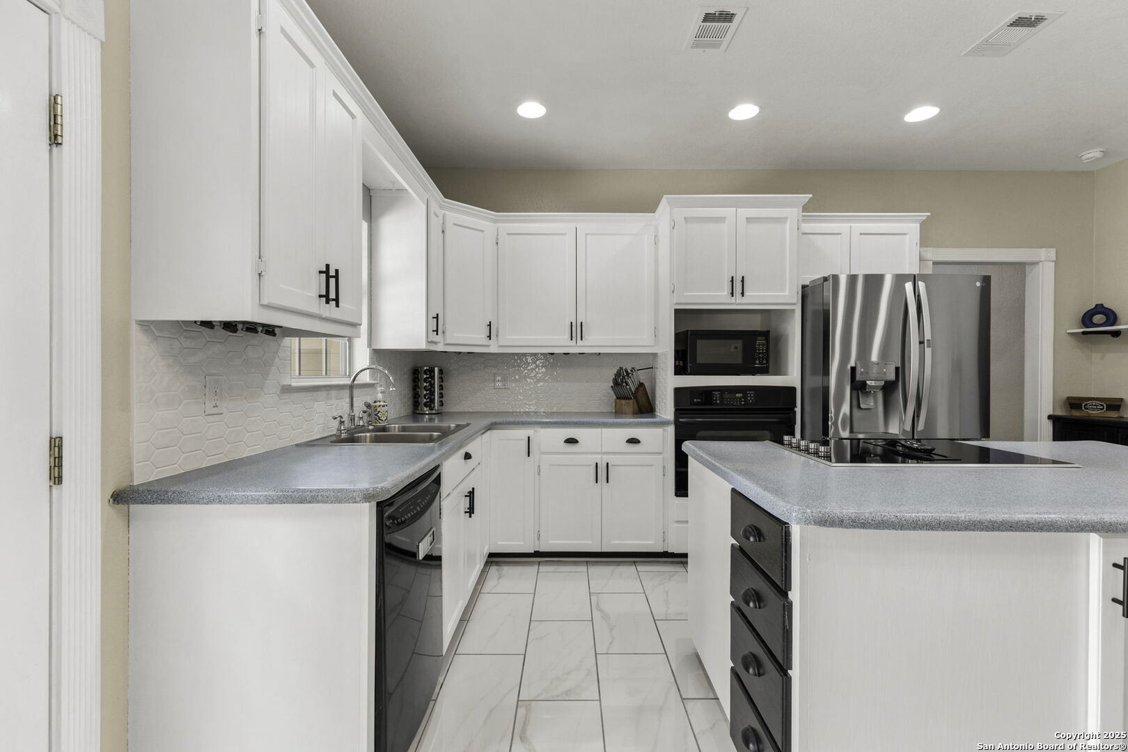 New tile backsplash and cabinet paint.
