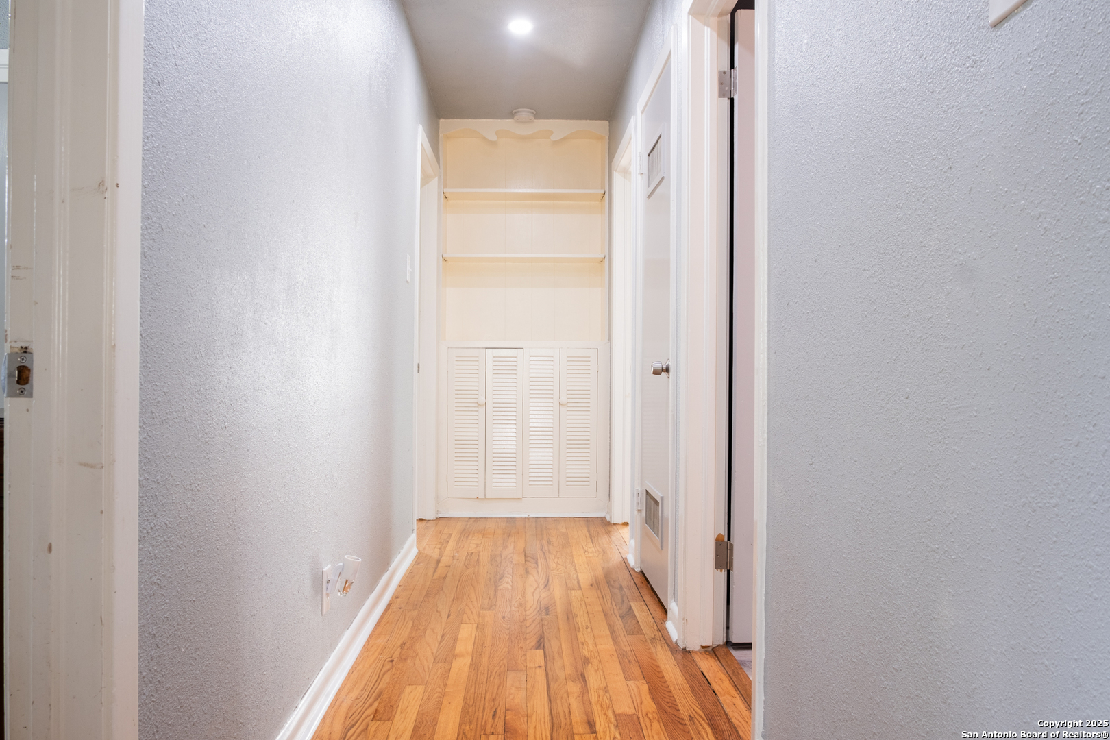 Hallway to guest rooms and bath