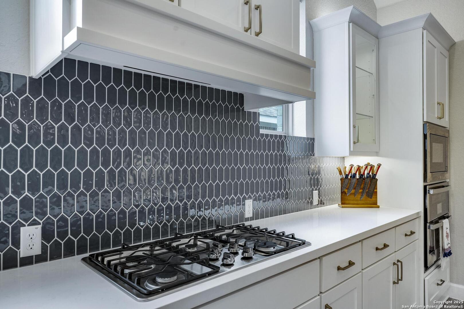 Gas cooktop, custom tiles