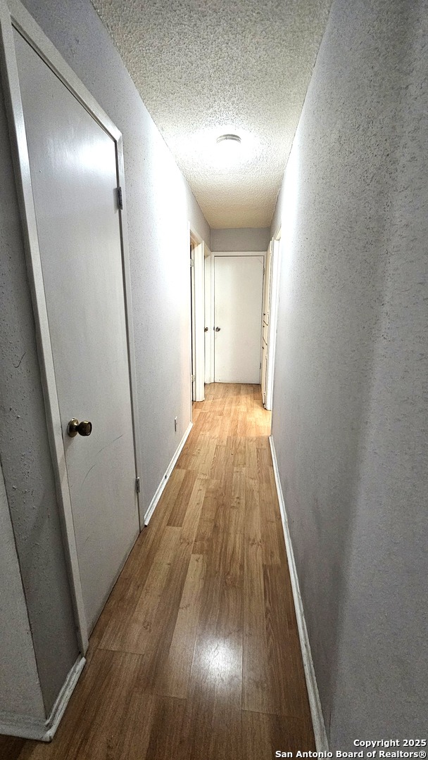 HALLWAY INTO THE REST OF THE BEDROOMS