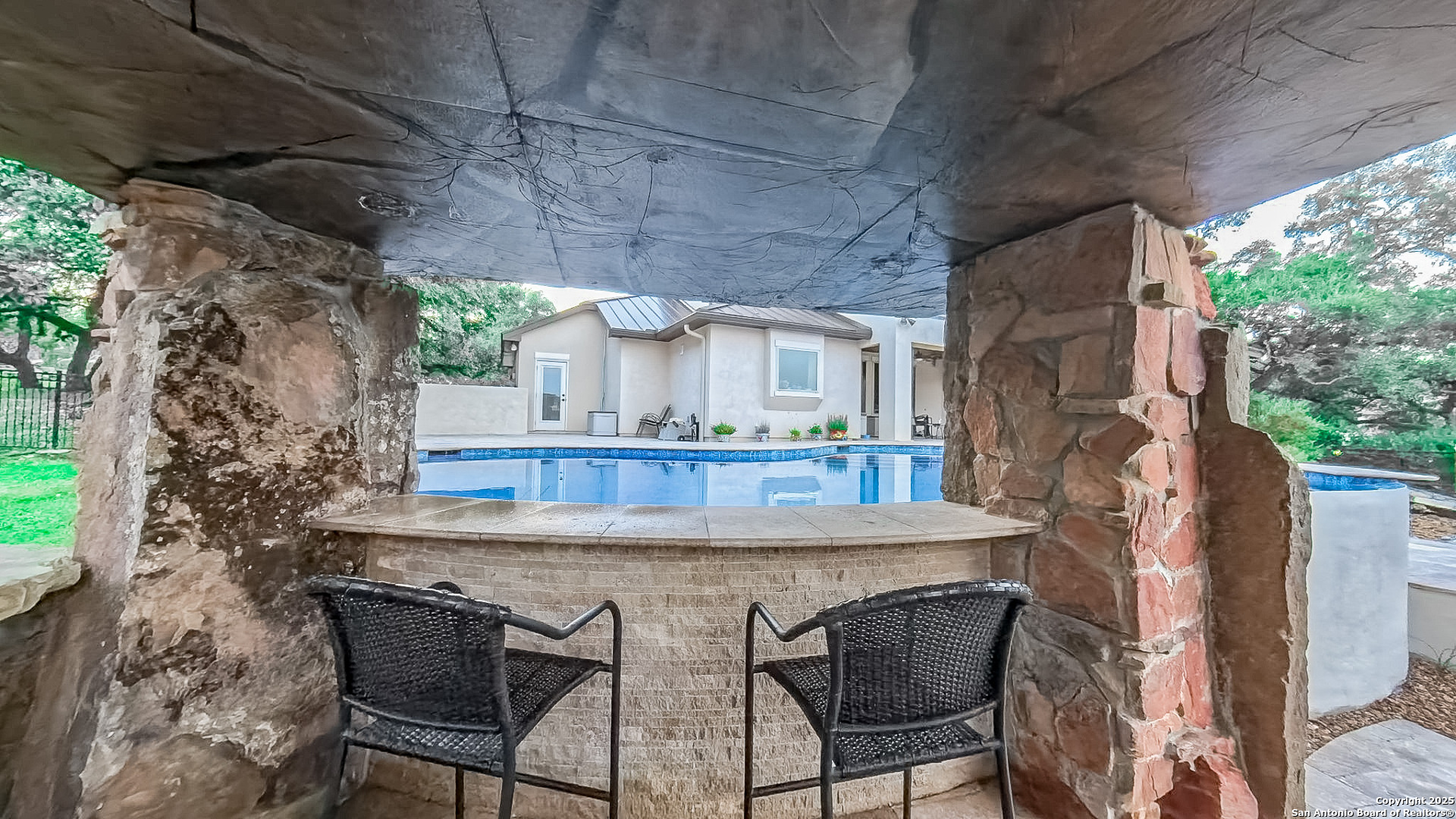 Heated pool with waterfall