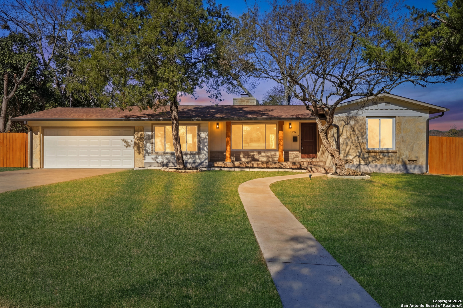Tucked away on a quiet street in the heart of desirable Terrell Hills, this charming stone ranch presents a rare opportunity to own in one of San Antonio's most prestigious neighborhoods.    Set on nearly 0.3 acres, the property offers an exceptional lot size surrounded by mature trees that provide privacy, shade, and long-term potential. The single-story home spans approximately 2,284 square feet and features a timeless stone exterior paired with a flexible, functional layout.    An open floor plan connects two expansive living areas, one anchored by a cozy fireplace-ideal for relaxed evenings or hosting guests. A functional office or bonus room adds versatile space for working from home, hobbies, or play. Large windows throughout fill the space with natural light and enhance the home's easy, comfortable flow.  The eat-in kitchen is well appointed with a premium gas range, full-size refrigerator and dishwasher, granite countertops, and abundant cabinetry with slide-outs for ease of access.     The primary suite serves as a private retreat, featuring a spa-inspired ensuite bath with a walk-in shower, garden tub, double vanity, and two large walk-in closets.    Outdoors, the expansive, fully fenced backyard offers plenty of room for outdoor living, expansion, or a complete reimagining of the property. A storage shed adds extra utility, while the generous yard provides a safe and inviting space for pets and children to enjoy.