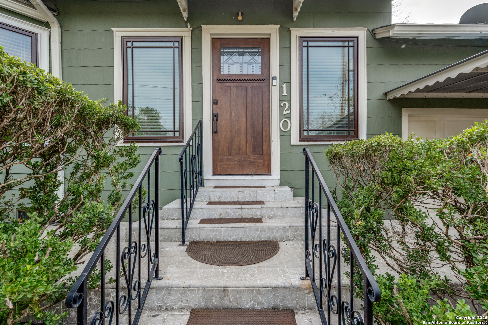 Perfect family or extended family home in Alam Heights that is within walking  distance to Cambridge Elementary and Alamo Heights High Schools. Versatile floorplan with two living areas, four bedrooms and three full baths, and exceptional storage. First floor includes living room, separate dining room, primary bedroom with deluxe bath and built-in closets/cabinet, second bedroom with built-in shelves, second full bathroom, small study or nursery, eat-in kitchen with multiple cabinets, family room with six French doors, utility room. Working wood fireplace and hardwood floors throughout this level. Lots of closets, including a walk-in under stairs. Ceiling fans, chandelier, mirrors. Attached one car garage and one carport in front driveway. Upstairs are two large bedrooms, each with extended walk-in closets with built-in shelves, and another full bathroom. High ceiling, fans, recessed lighting and carpeting throughout. Pella or Marvin windows (some custom-sized) make for light-filled but quiet and controlled air space, with wood blinds and shutters throughout the entire home; two separate units central AC for flexible use. Extra-wide lot, with room in back yard for large garage and/or pool, play area for children and pets. Wood siding on two-story addition in back. Covered patio and back driveway (three cars wide at top) are already poured. Must see this customizable and wonderful living space, with many desirable features already in place.