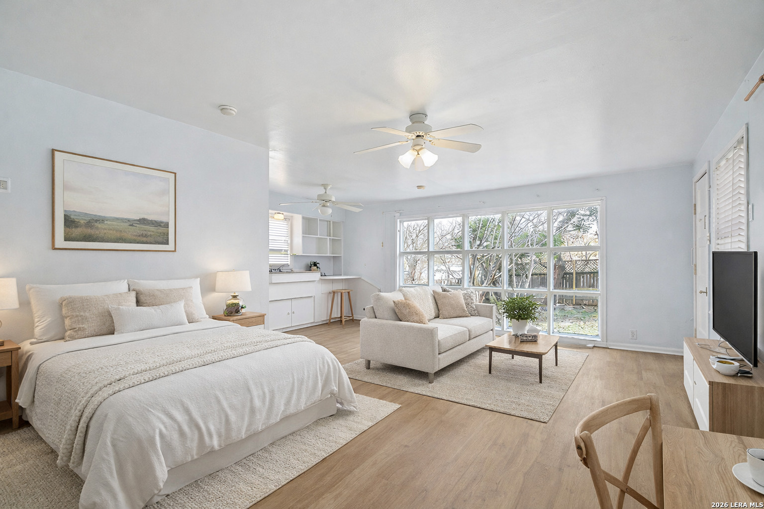 Nestled on an exceptional double lot in the heart of Mahncke Park, 507 Parland Place offers a rare blend of space, versatility, and prime location-directly across from the San Antonio Botanical Garden and moments from the San Antonio Country Club, Brackenridge Park, the Pearl District, Zoo, Airport, dining, shopping, and major cultural destinations.        Lovingly cared for over decades, the property is surrounded by mature trees thoughtfully planted by the owner, creating a peaceful, park-like setting rarely found this close to the city's core. From the primary bedroom, large windows frame tranquil views of greenery-an everyday retreat that has been treasured for generations.    The main residence features 1,963 square feet with solid wood and hardwood flooring, a wood-burning fireplace with a timeless mantel, and a spacious living room anchored by a large bay window overlooking the neighborhood. Built-in hutches, shelving, and display cabinetry add warmth, character, and thoughtful storage throughout. A kitchen addition expands the living space and offers excellent functionality with two sinks (filtered water), abundant natural light overlooking the large yard, an eat-in kitchen, generous pantry space with natural light, and flexible layout-ready to enjoy today or reimagine to suit your future vision. The primary suite includes an ensuite bath and two closets, while secondary bedrooms provide flexibility for guests, office, or creative use. A secondary bathroom features a large, jetted tub enhancing everyday comfort.        Adding exceptional value and flexibility is the detached two-car garage with private studio/casita, offering approximately 460 square feet of living space with a full bathroom and kitchenette. This versatile structure presents outstanding potential for multigenerational living, guest accommodations, private home office or studio, or income-generating use, subject to buyer verification of zoning and use requirements.        Set on approximately 1/3 of an acre, this double lot property stands out within Mahncke Park for its lot size, layout, and versatility. With a total of approximately 2,423 sq ft of living space this is a truly unique opportunity to own a property with both character and long-term upside in one of San Antonio's most desirable neighborhoods.    Eclectic in spirit and rich with history, 507 Parland Place invites buyers to see the potential, envision possibilities, and create something truly special-whether enjoyed as-is or thoughtfully reimagined for the next chapter.