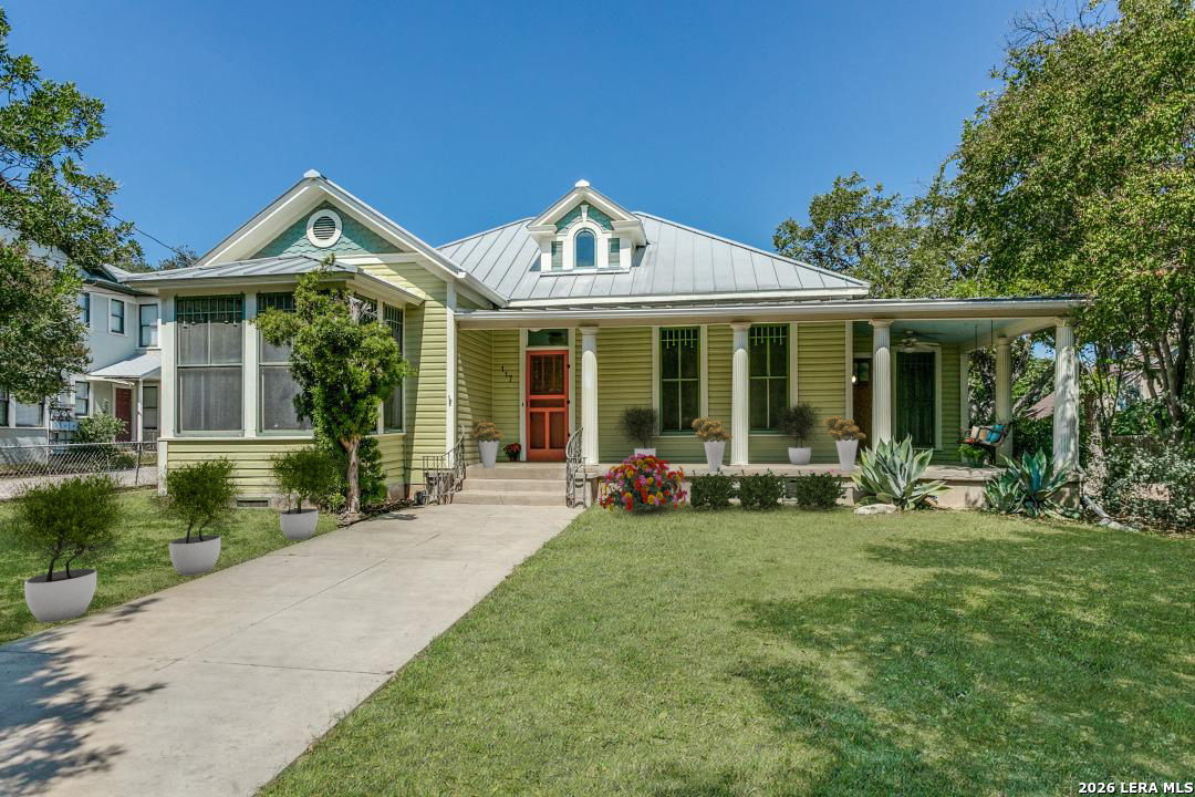 OPEN SUNDAY MAR 1ST 3-5PM.   Urban living in Historic Monte Vista!  This grand one-story, well into it's second century and listed in the National Register of Historic Places, is one of the oldest structures in the neighborhood.  An expansive wrap-around front porch with swing lets you enjoy the vibrancy of this thriving historic and entertainment district.  Mere blocks from all the popular dining spots that make Monte Vista a "destination!" The home is full of towering seven foot windows, interior glass doors and high transoms. The living room has a window-lined "bump out," offering cozy seating and a view of the tree-lined avenue. A unique double fireplace lends ambience to both the living and formal dining areas. The kitchen is large, bright and open, overlooking a New Orleans-styled bricked courtyard. (Kitchen IS plumbed for gas cooking!) Secondary bath is updated with separate shower and Japanese soaking tub. And if all of that is not enough, there is a charming three-room apartment above the detached two-car garage. Opening to a spacious deck and perched in the tree canopy, this "treehouse" features a living area, bedroom, bathroom, and bright, cheery kitchen lined with windows. Tremendous long or short-term rental opportunities. Two car garage plus extra off street parking in the oak-lined driveway. EASY BIKE RIDE TO THE PEARL!