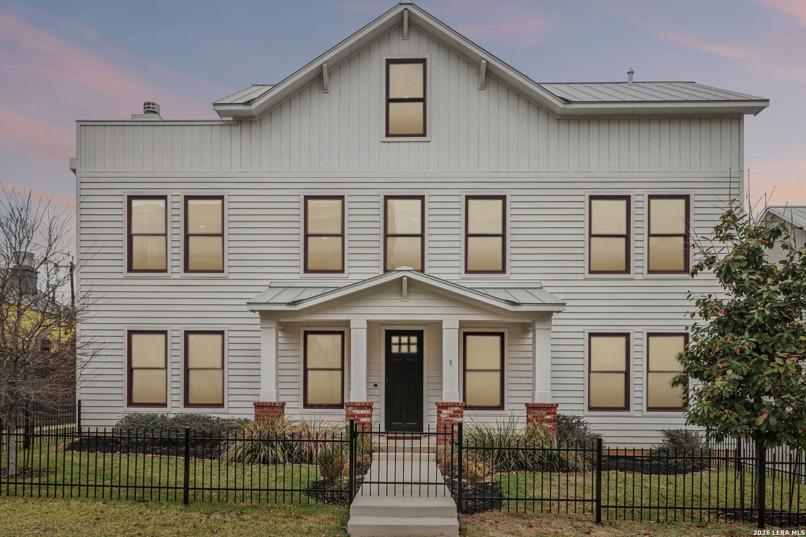 Modern Luxury at 311 E Evergreen | First-Floor Living & Private Putting Green  The Ultimate Social Floor Plan is the perfect blend of high-end design and walkability. Across the street from Metropolitan Methodist Hospital, 5 blocks to The Pearl, and walkable to the Museum Reach, and the vibrant Broadway corridor.  Experience a rare architectural layout at 311 E Evergreen. Unlike typical urban builds, the heart of this home is located exactly where it should be: on the first floor. The open-concept kitchen, dining, and living zones flow seamlessly, anchored by a gourmet kitchen with KitchenAid gas appliances and custom cabinetry. It's the perfect setting for hosting, with direct access to your private outdoor putting green-a no-maintenance backyard built for enjoyment.  Sophisticated Vertical Design. At the top of the second floor, a curated landing space offers the perfect footprint for a home office, a fitness space, or a midnight coffee bar just steps from the bedrooms.  Triple-Suite Privacy: Designed for the modern professional, every bedroom serves as a private retreat with its own dedicated en-suite bathroom. No shared baths, no compromises-ideal for guests or high-end roommate configurations.  The Rooftop Escape: Ascend to the third level to your private rooftop deck, offering city views, a sink and counterspace, and an outdoor fireplace. It's your front-row seat to the city's energy, perfect for sunset drinks before walking to the Pearl District.  Executive Conveniences  Lock-and-Leave Ready: A secure 2-car attached garage and low-maintenance grounds in the premier 78212 zip code.  Walkable Luxury: Leave the car behind and walk to award-winning dining at Hotel Emma or a morning run along the Museum Reach River Walk.  Urban elegance. Unbeatable location. Your Tobin Hill sanctuary awaits.