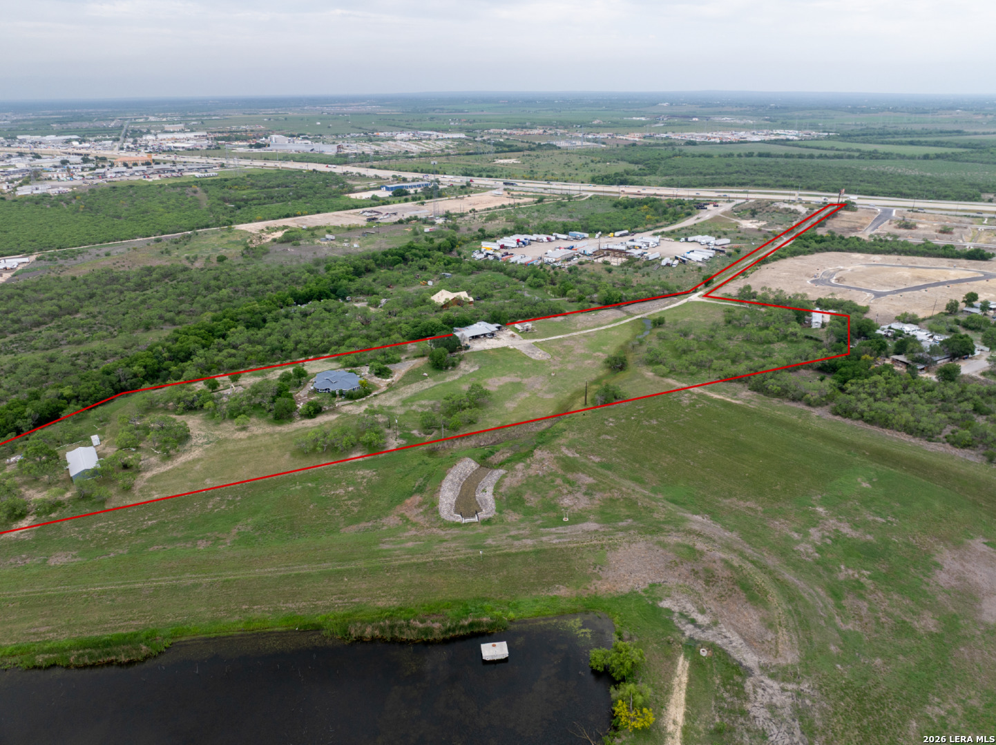 Prime 13.873 AC Commercial Opportunity on I-10 Frontage | Excellent opportunity to acquire a 13.873 AC tract located at 8059 Interstate I-10 E. Situated just outside the city limits, this property offers exceptional flexibility and minimal zoning restrictions, making it ideal for a wide range of commercial uses.  With direct I-10 frontage and exposure to over 54,000 vehicles per day, the site provides unmatched visibility. Existing improvements include a monument sign, an active helipad, and utility infrastructure with electricity, water, and sewer already in place-reducing development time and costs.  Positioned in a rapidly growing corridor with strong traffic counts, this site is ideal for investors, developers, or end users seeking a strategically located property with valuable infrastructure and unique aviation capabilities.