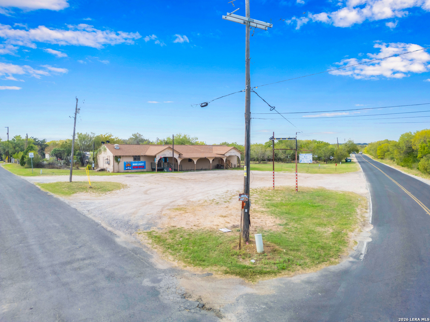 COMMERCIAL OPPORTUNITY ON 1 ACRE (OCL ZONING)!!  Unlock the potential of this versatile commercial property situated on approximately 1 acre in the growing Southwest San Antonio corridor. Located outside city limits (OCL), this property offers increased flexibility making it ideal for a wide range of business uses.    The site features an existing 2,576 SF building, providing a solid foundation for owner-users or investors looking to establish or expand their operations. With ample land, there is plenty of room for additional structures, parking, storage, or outdoor business needs.    Strategically positioned near major highways including IH-35 and Hwy 90, the property benefits from convenient access and proximity to rapidly expanding residential communities-bringing continued growth and visibility to the area.    Perfect for contractors, automotive services, bar/tavern use, event space, or a variety of commercial ventures, this property offers the rare combination of space, location, and flexibility.    Whether you're looking to operate your business, generate rental income, or invest in a high-growth area, this property presents an exceptional opportunity with long-term upside. ALL furniture, fixtures, accessories, and equipment convey with the property.