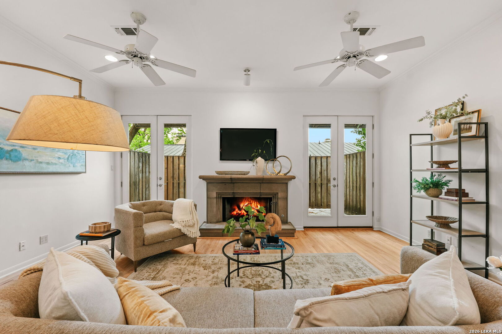 Open House Saturday & Sunday 1-3pm. Discover effortless living in the heart of Alamo Heights. Newly refinished hardwood floors and freshly  painted, this beautifully designed 2-bedroom, 2.5-bath townhouse invites you to entertain, unwind, and live well with an open-concept kitchen that flows seamlessly into the living and dining spaces. Tucked upstairs, the "treehouse-style" bedrooms feel like a private retreat, featuring vaulted ceilings and generous walk-in closets. Arrive home through a charming gated flagstone courtyard, enjoy the ease of secured two-car garage parking, and take the elevator or stairs to your front door. Whether you're hosting friends or enjoying a quiet night in, this home blends comfort, style, and premier location in one of Alamo Heights most sought-after neighborhoods.  This unit is one of 4 units currently for sale in the complex... the other 3 have long term tenants ... all 4 can be purchased for bundle price of $2.2m... 137 St Dennis is the only unit that can be moved into and purchased separately.